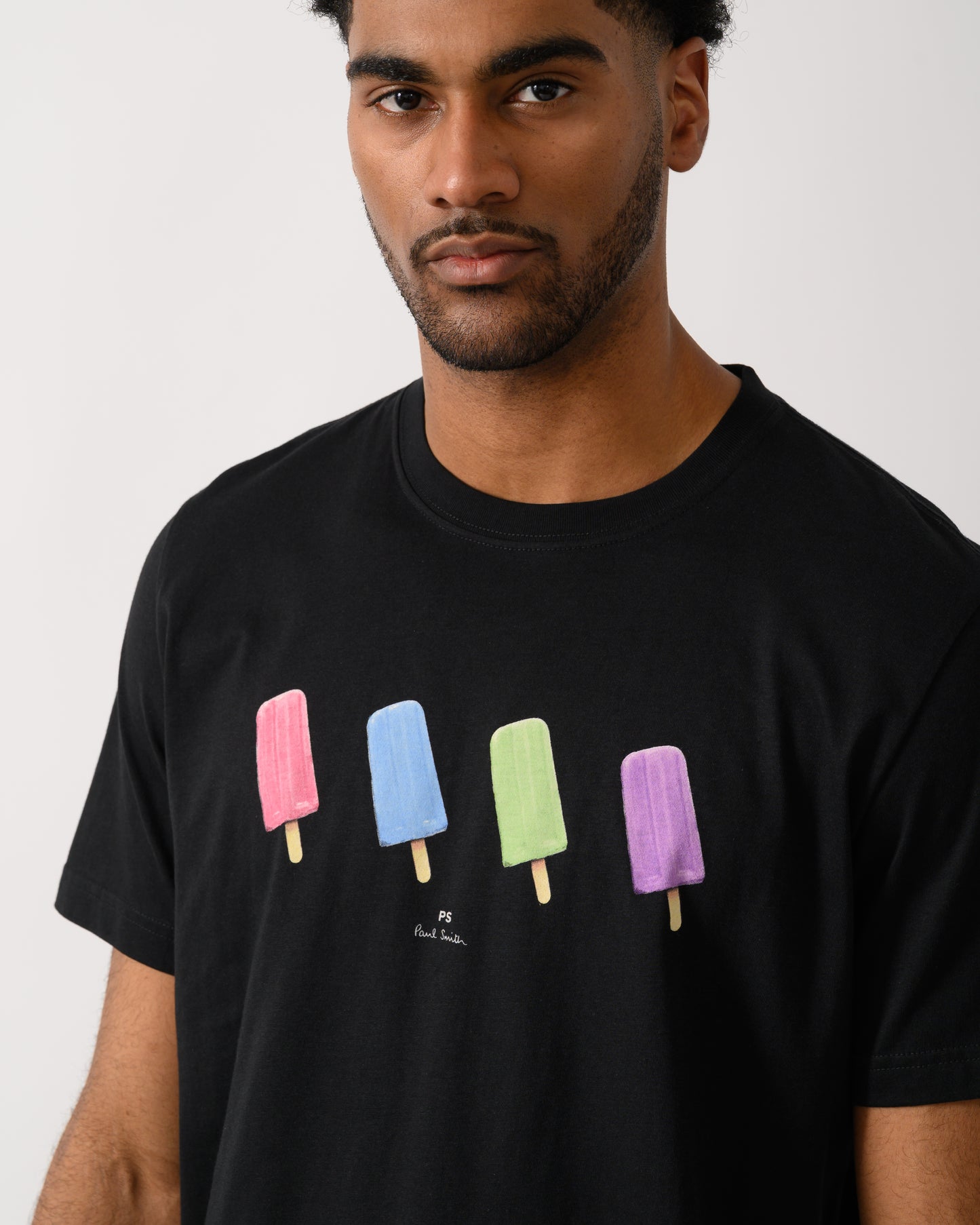 close up shot of a model wearing a PS Paul Smith Mens Regular Fit Lollies T-Shirt in 79 Black
