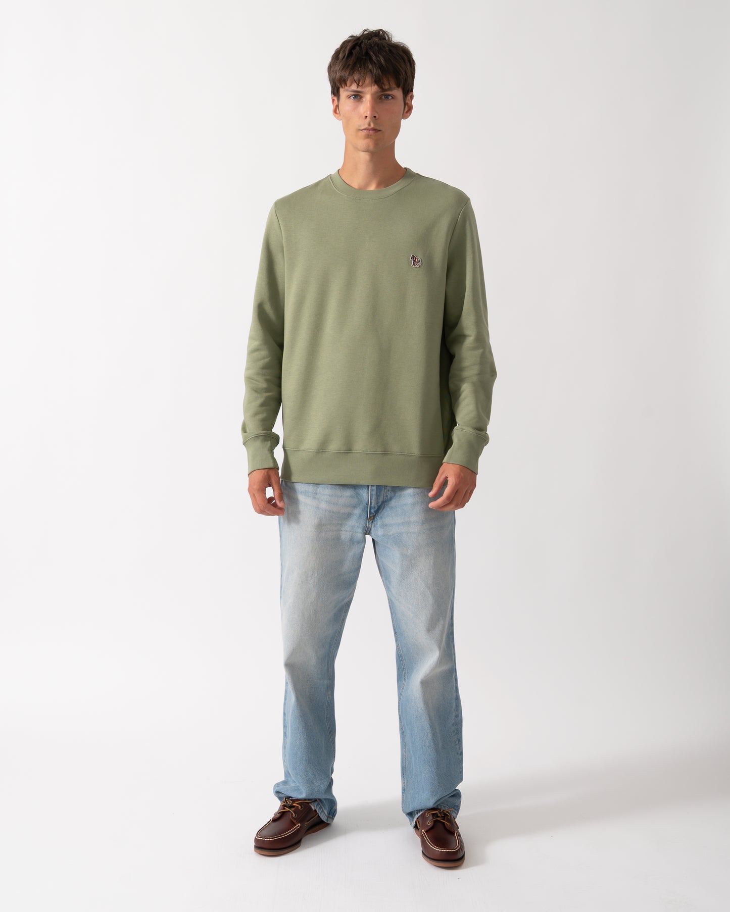 full length of a model wearing a PS Paul Smith Mens Regular Fit Organic Cotton Zebra Logo Sweatshirt in 34C Light Greyish Green