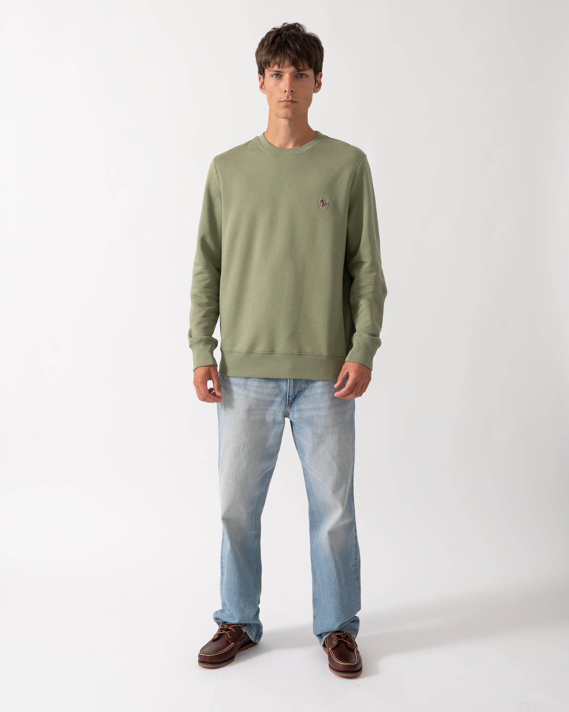 full length of a model wearing a PS Paul Smith Mens Regular Fit Organic Cotton Zebra Logo Sweatshirt in 34C Light Greyish Green
