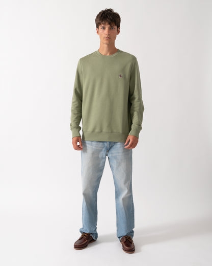 full length of a model wearing a PS Paul Smith Mens Regular Fit Organic Cotton Zebra Logo Sweatshirt in 34C Light Greyish Green