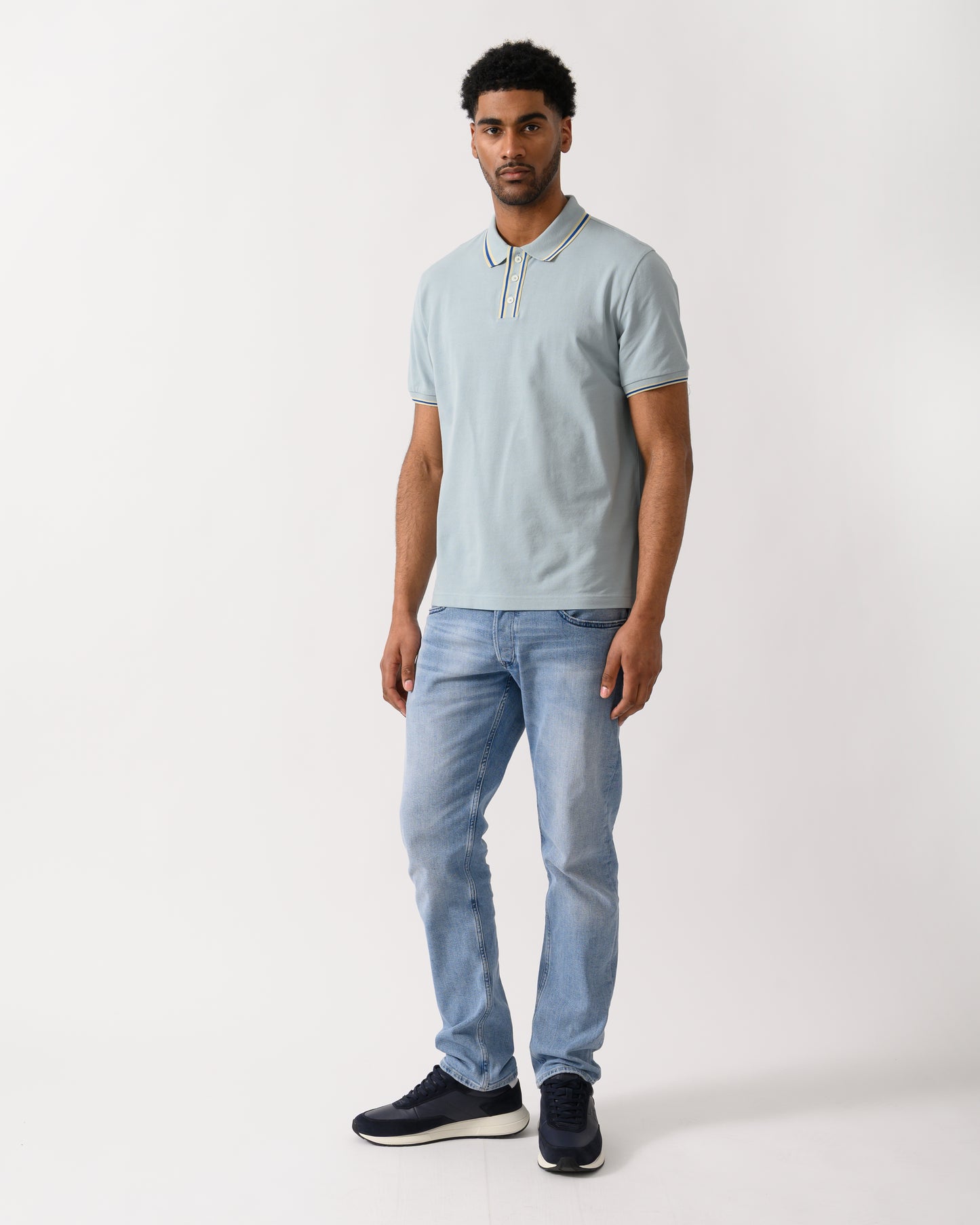 full lenght shot of a model wearing a PS Paul Smith Mens Regular Fit Polo Shirt in 40B Blue