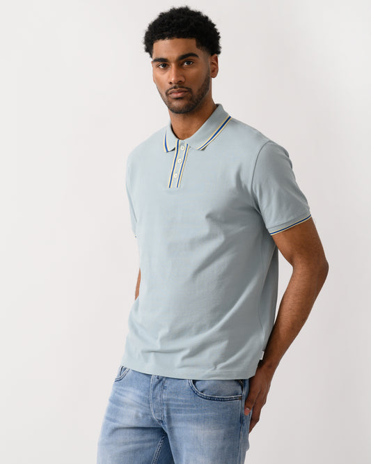 model wearing a PS Paul Smith Mens Regular Fit Polo Shirt in 40B Blue