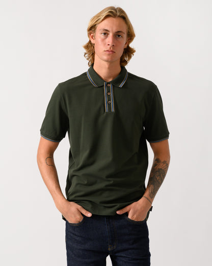 studio photograph of a model wearing PS Paul Smith Mens Regular Fit Polo Shirt with Tipping in 38E Bottle Green