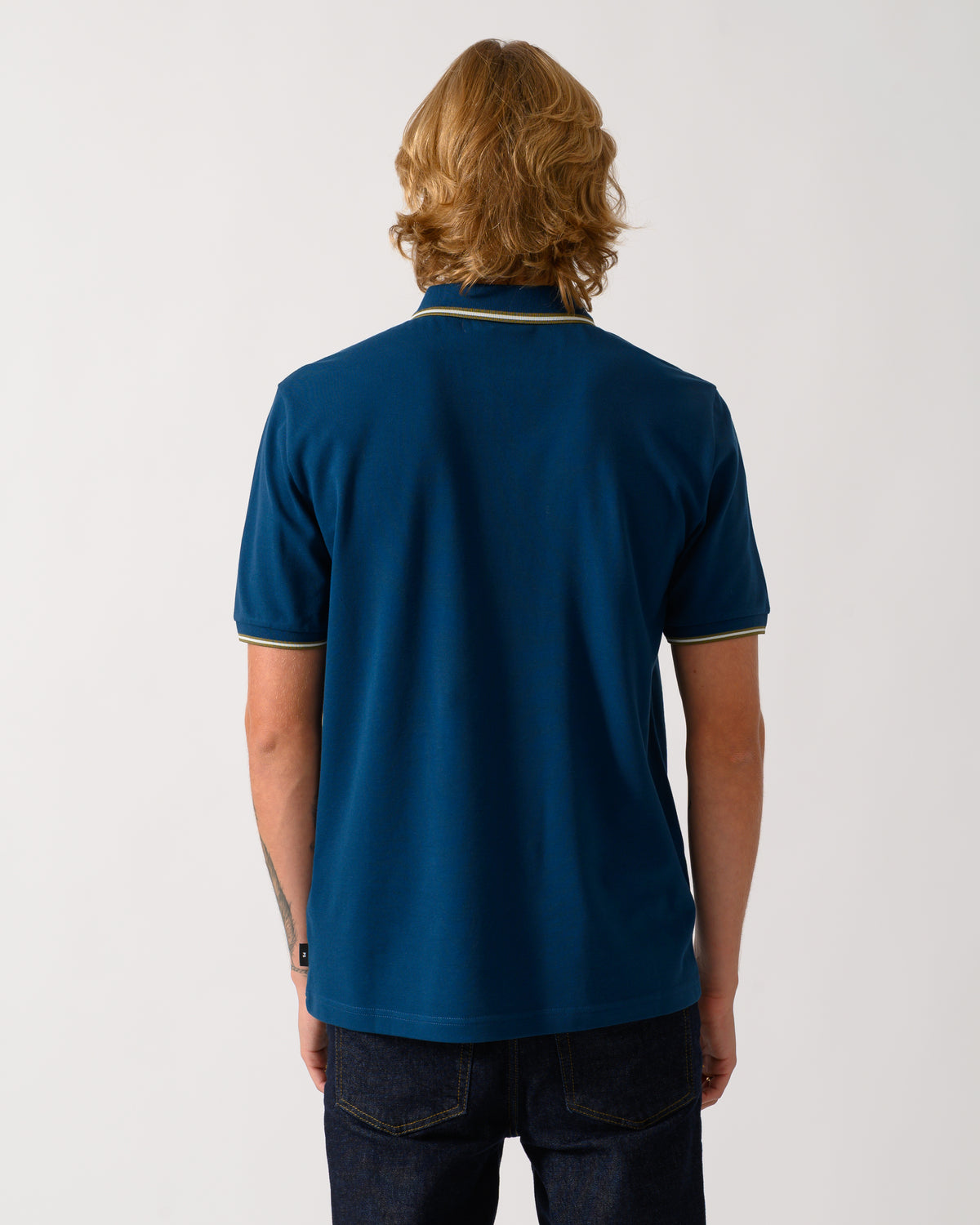 studio photo of the back of a model wearing a PS Paul Smith Mens Regular Fit Polo Shirt with Tipping in 47 Navy