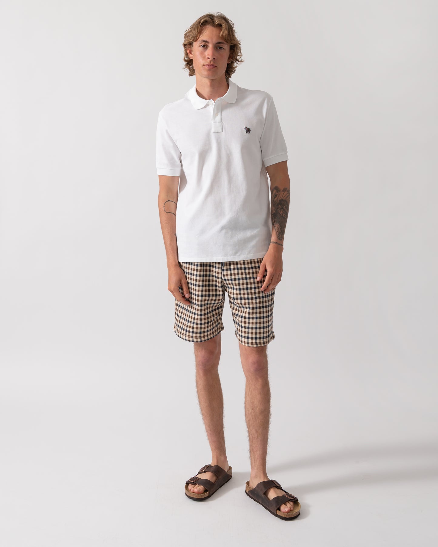 full length shot of model wearing a PS Paul Smith Mens Regular Fit Short Sleeve Zebra Logo Polo Shirt M2R-183K-WZEBRA in 01 White