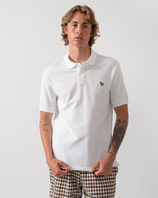 model wearing a PS Paul Smith Mens Regular Fit Short Sleeve Zebra Logo Polo Shirt M2R-183K-WZEBRA in 01 White