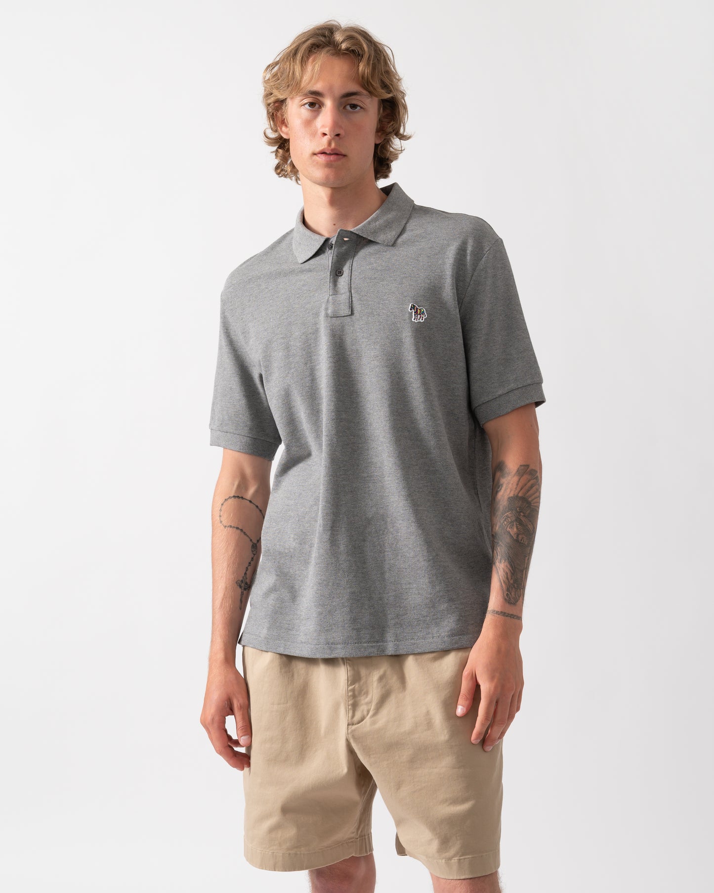 model wearing a PS Paul Smith Mens Regular Fit Short Sleeve Zebra Logo Polo Shirt M2R-183K-WZEBRA in 72 Grey