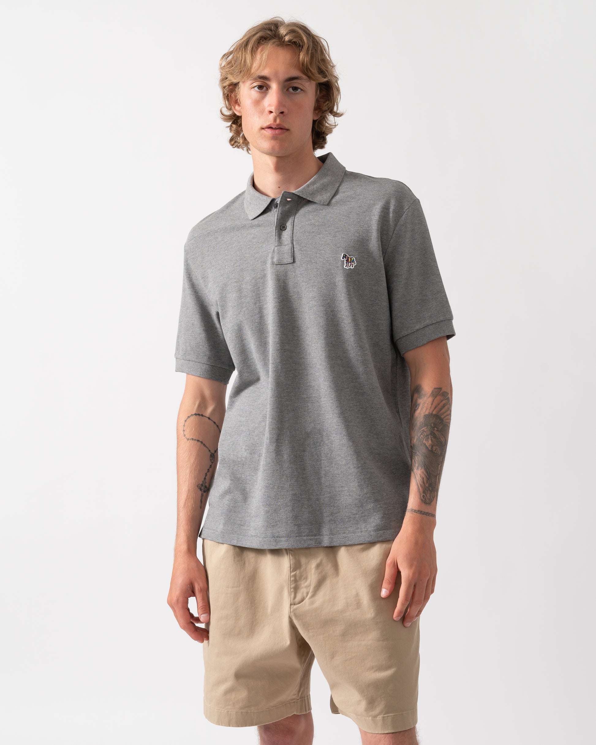 model wearing a PS Paul Smith Mens Regular Fit Short Sleeve Zebra Logo Polo Shirt M2R-183K-WZEBRA in 72 Grey