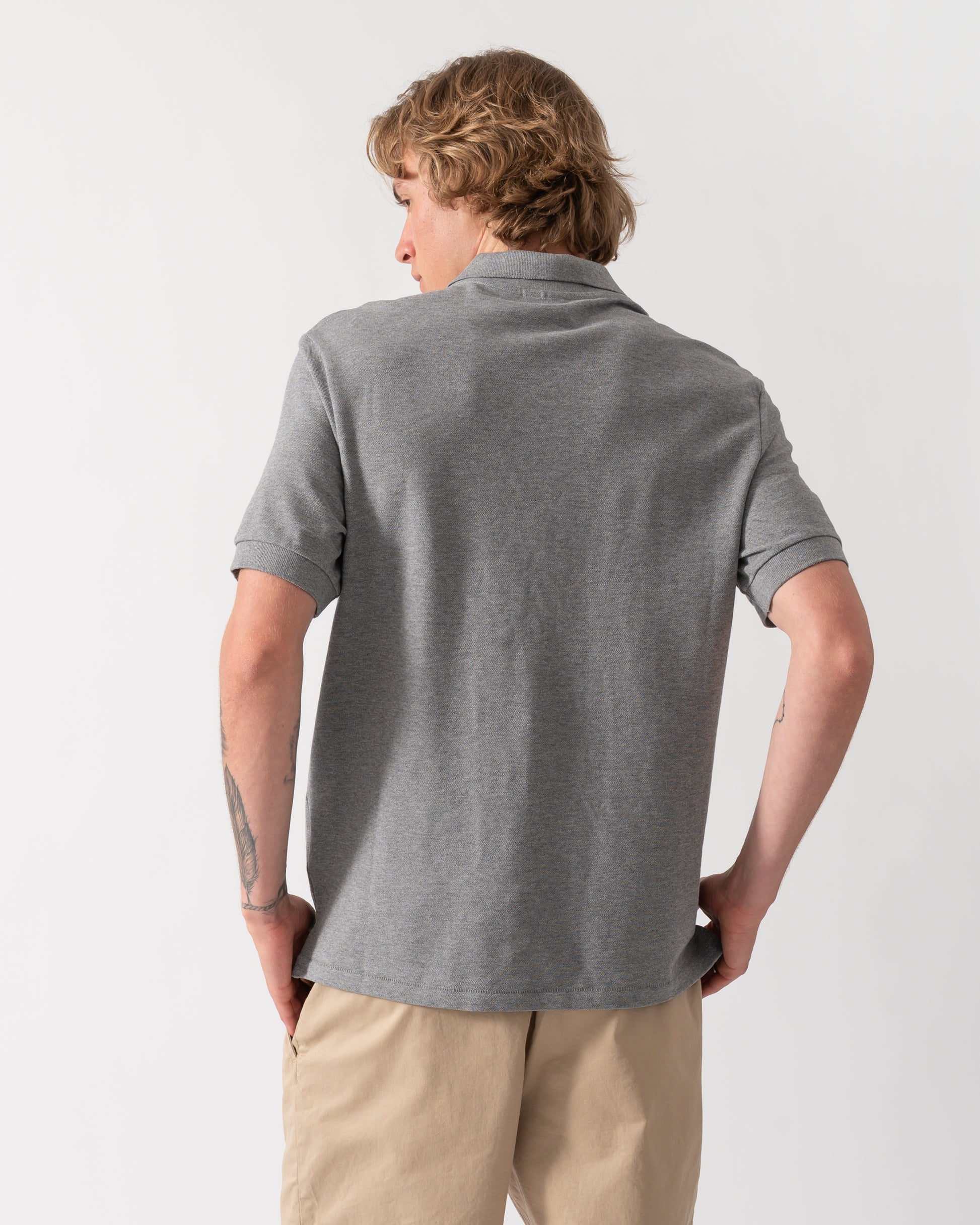 back of model wearing a PS Paul Smith Mens Regular Fit Short Sleeve Zebra Logo Polo Shirt M2R-183K-WZEBRA in 72 Grey