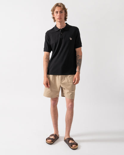 full length shot of model wearing a PS Paul Smith Mens Regular Fit Short Sleeve Zebra Logo Polo Shirt M2R-183K-WZEBRA in 79 Black