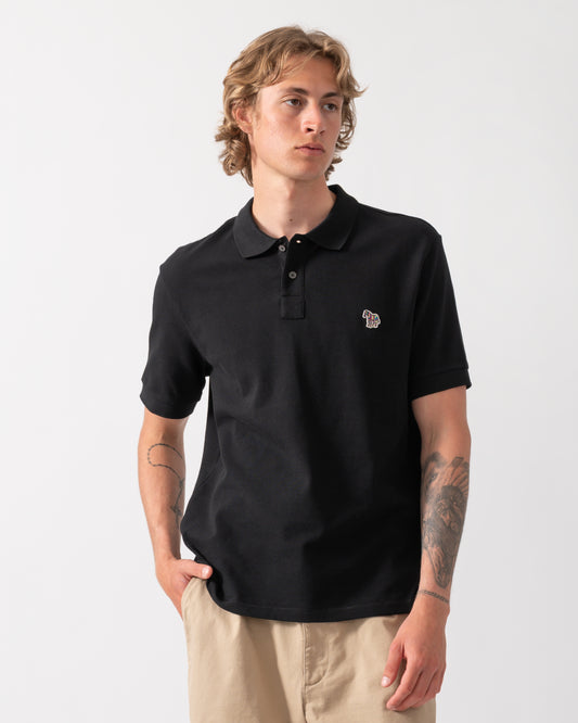 model wearing a PS Paul Smith Mens Regular Fit Short Sleeve Zebra Logo Polo Shirt M2R-183K-WZEBRA in 79 Black
