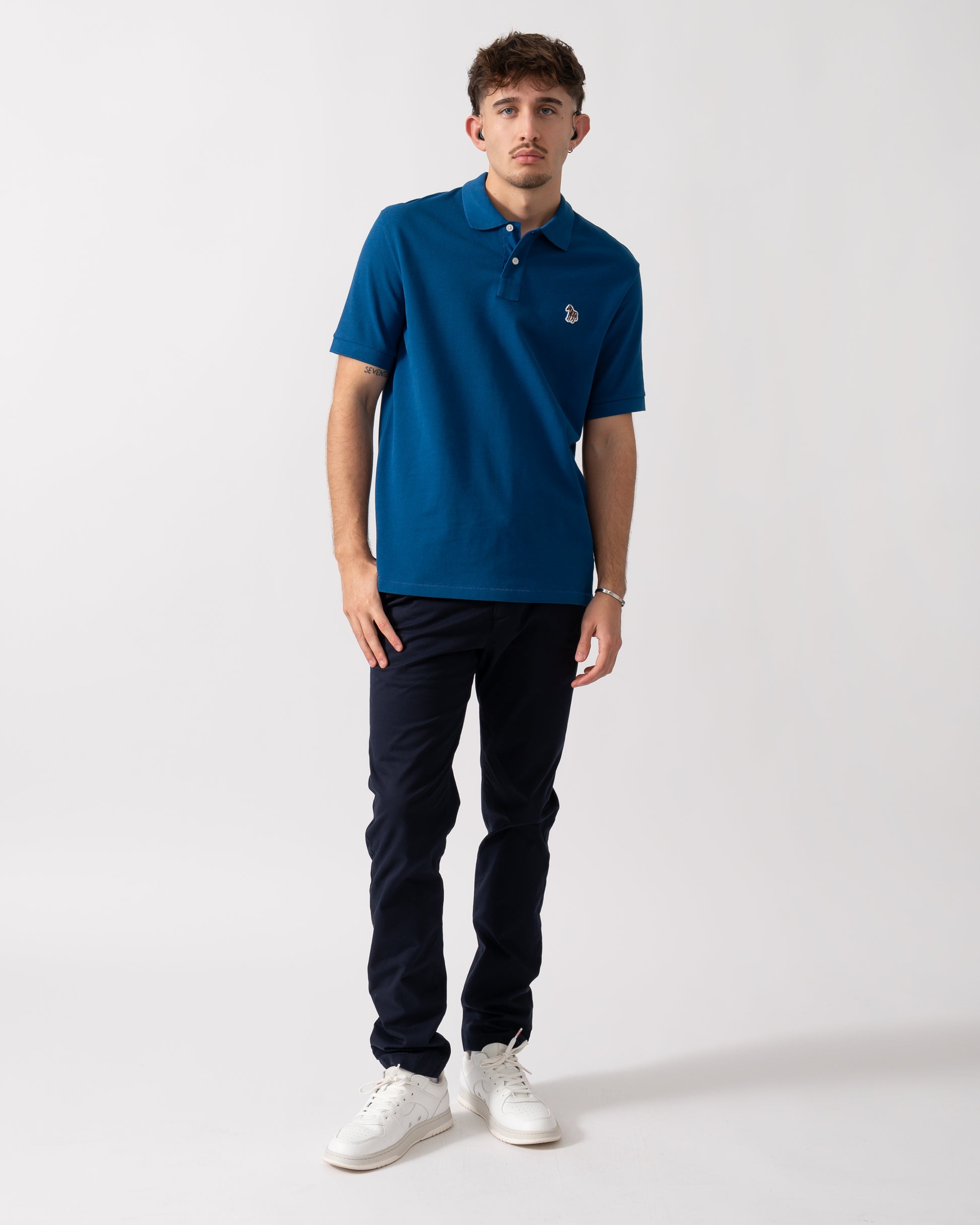 Full length of a Model wearing a PS Paul Smith Mens Regular Fit Short Sleeve Zebra Polo Shirt in Blue