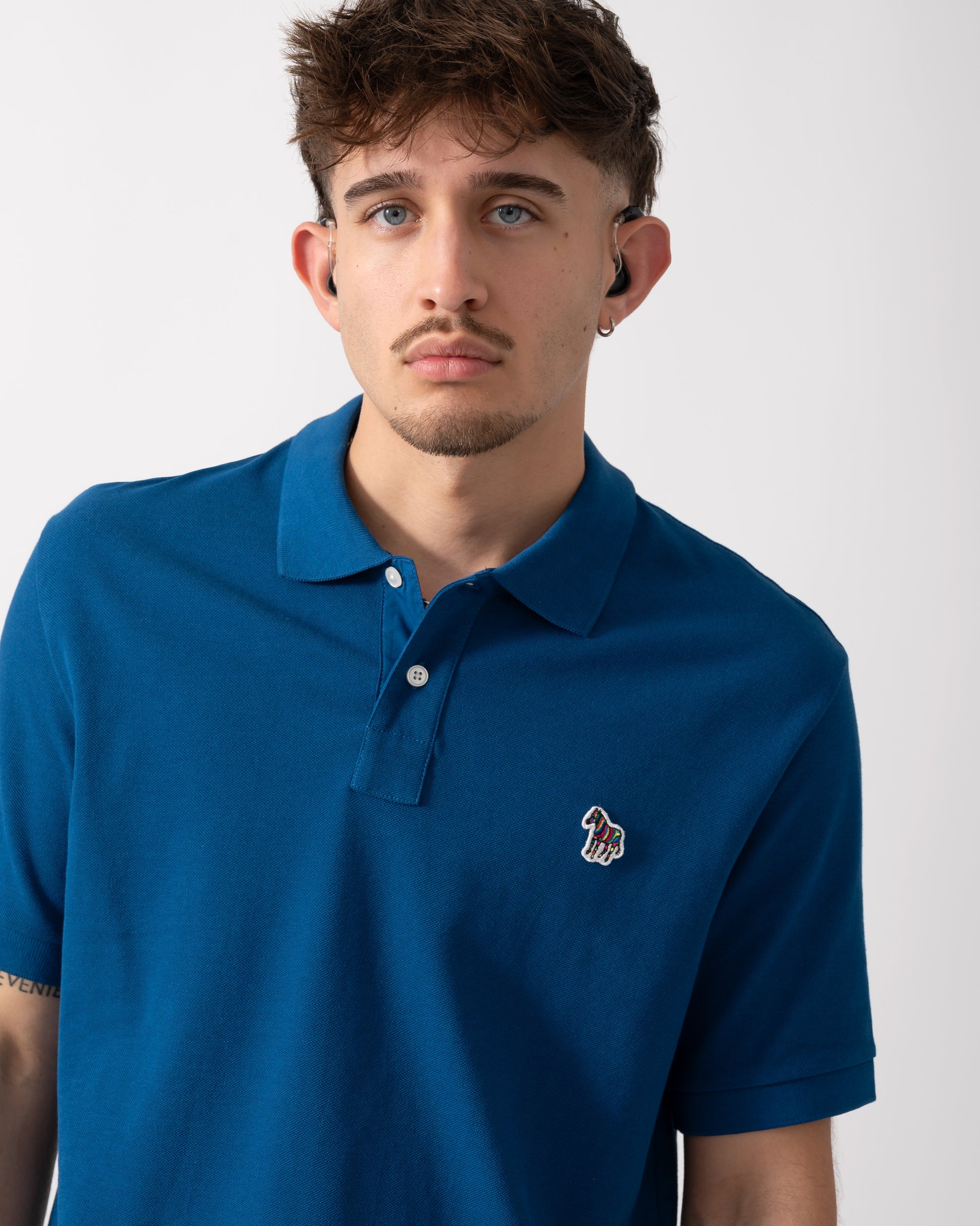 Detail of a Model wearing a PS Paul Smith Mens Regular Fit Short Sleeve Zebra Polo Shirt in Blue