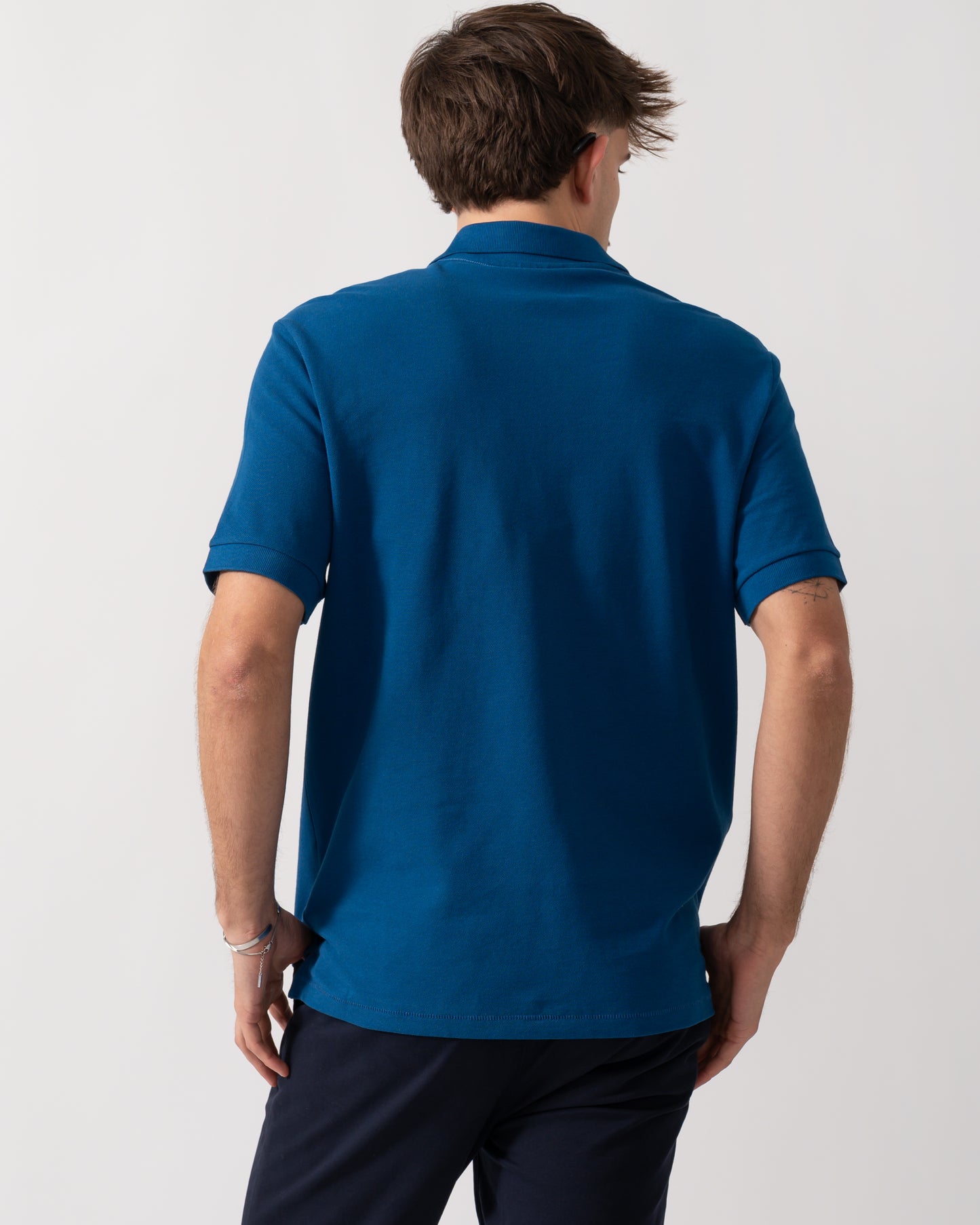 back detail of a Model wearing a PS Paul Smith Mens Regular Fit Short Sleeve Zebra Polo Shirt in Blue