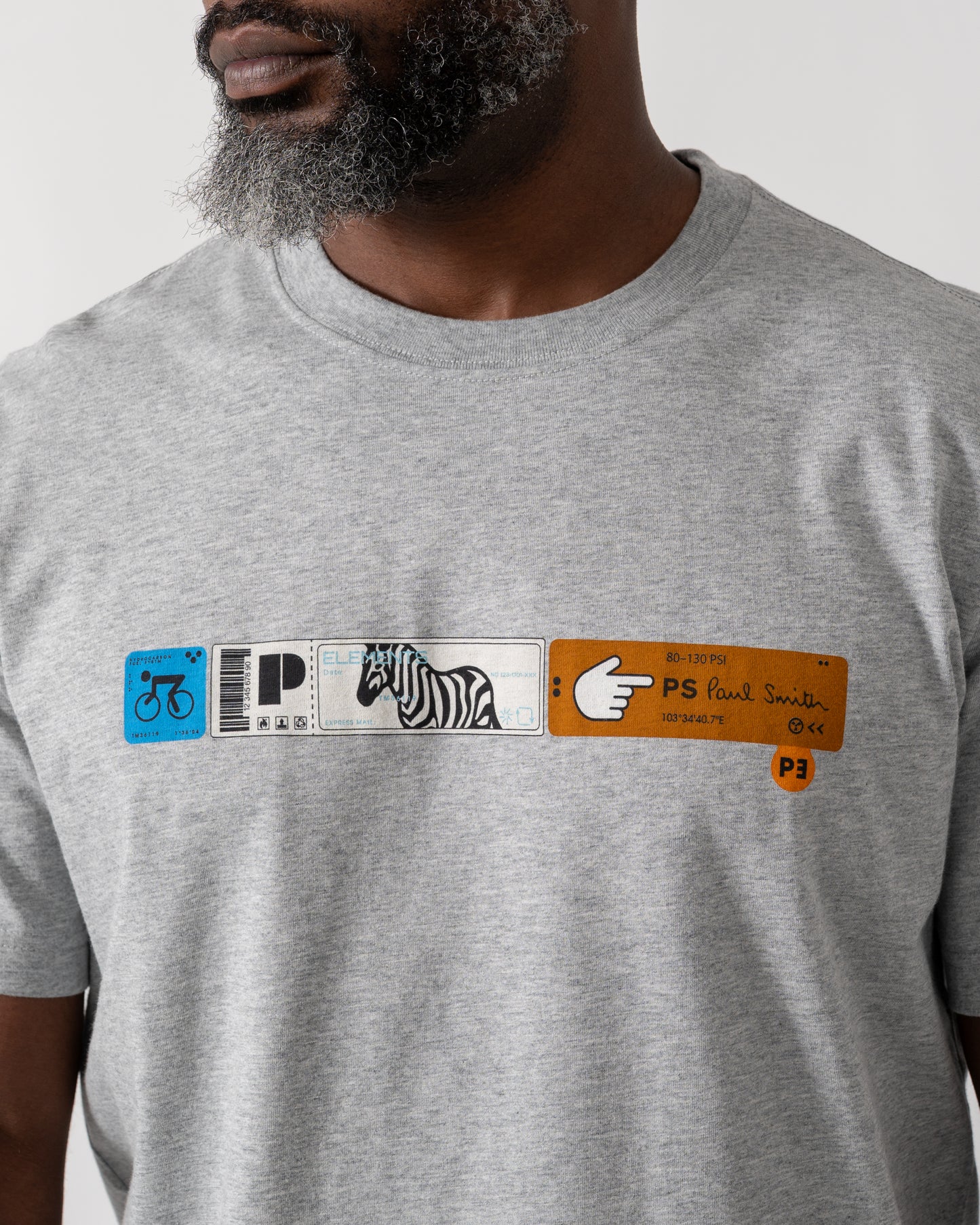 detail shot of a Model wearing a PS Paul Smith Mens Ticket Stub T-Shirt in Grey