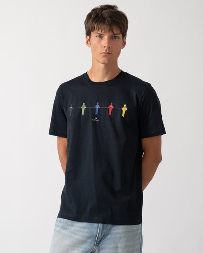 a model wearing a PS Paul Smith Mens Regular Fit Table Football Graphic T-Shirt in 49 Very Dark Navy