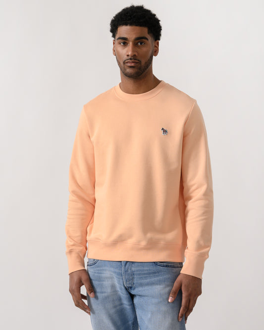 model wearing a PS Paul Smith Mens Regular Fit Zebra Sweatshirt in 15D Orange