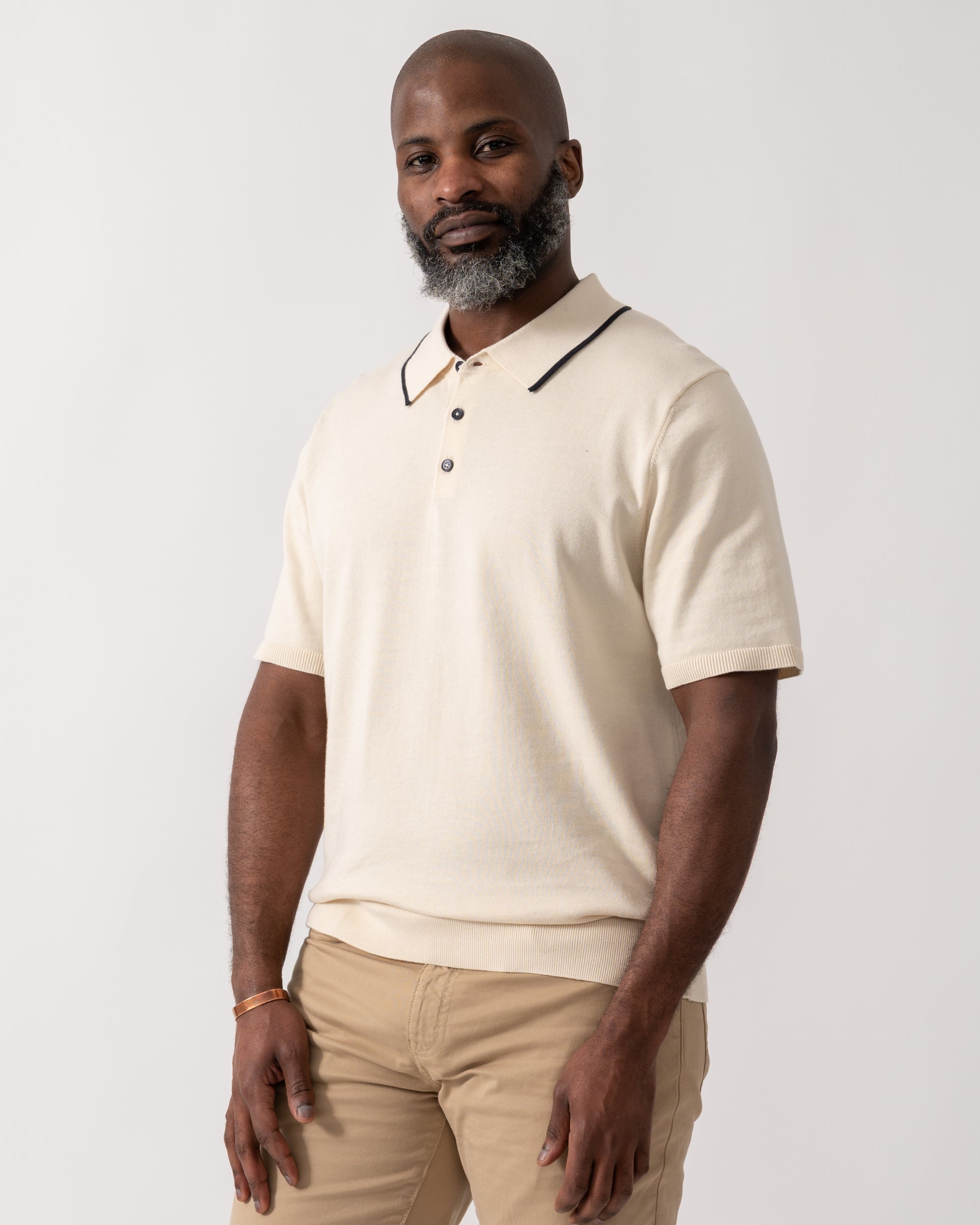 model wearing a PS Paul Smith Mens Short Sleeve Knit Polo in White