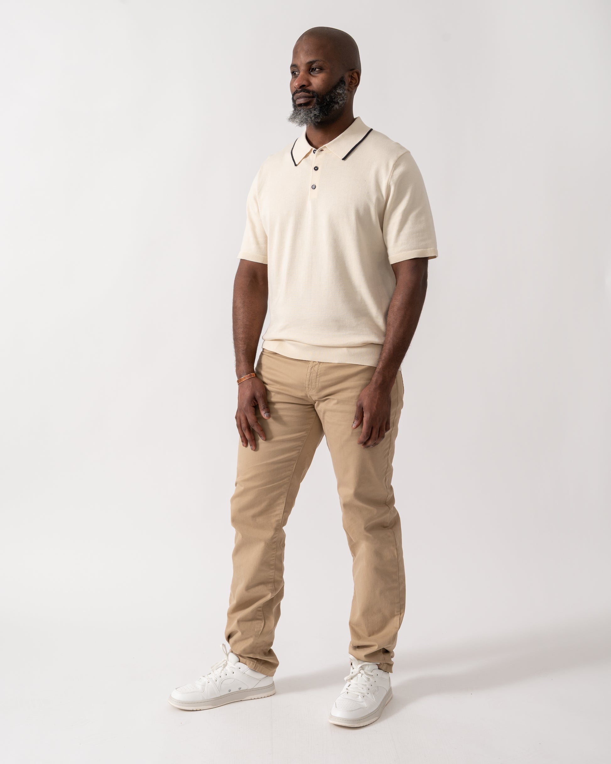 full length shot of a model wearing a PS Paul Smith Mens Short Sleeve Knit Polo in White