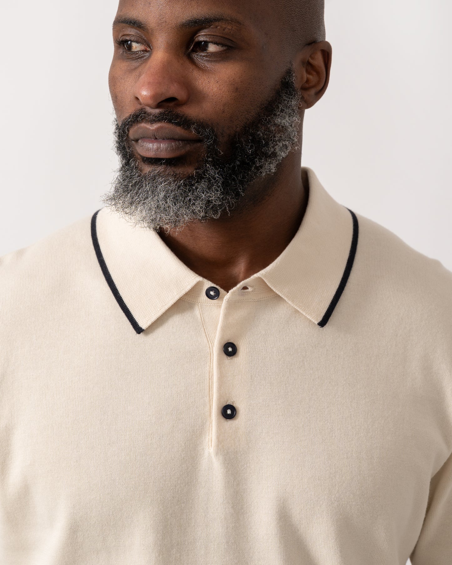 detial shot of a model wearing a PS Paul Smith Mens Short Sleeve Knit Polo in White