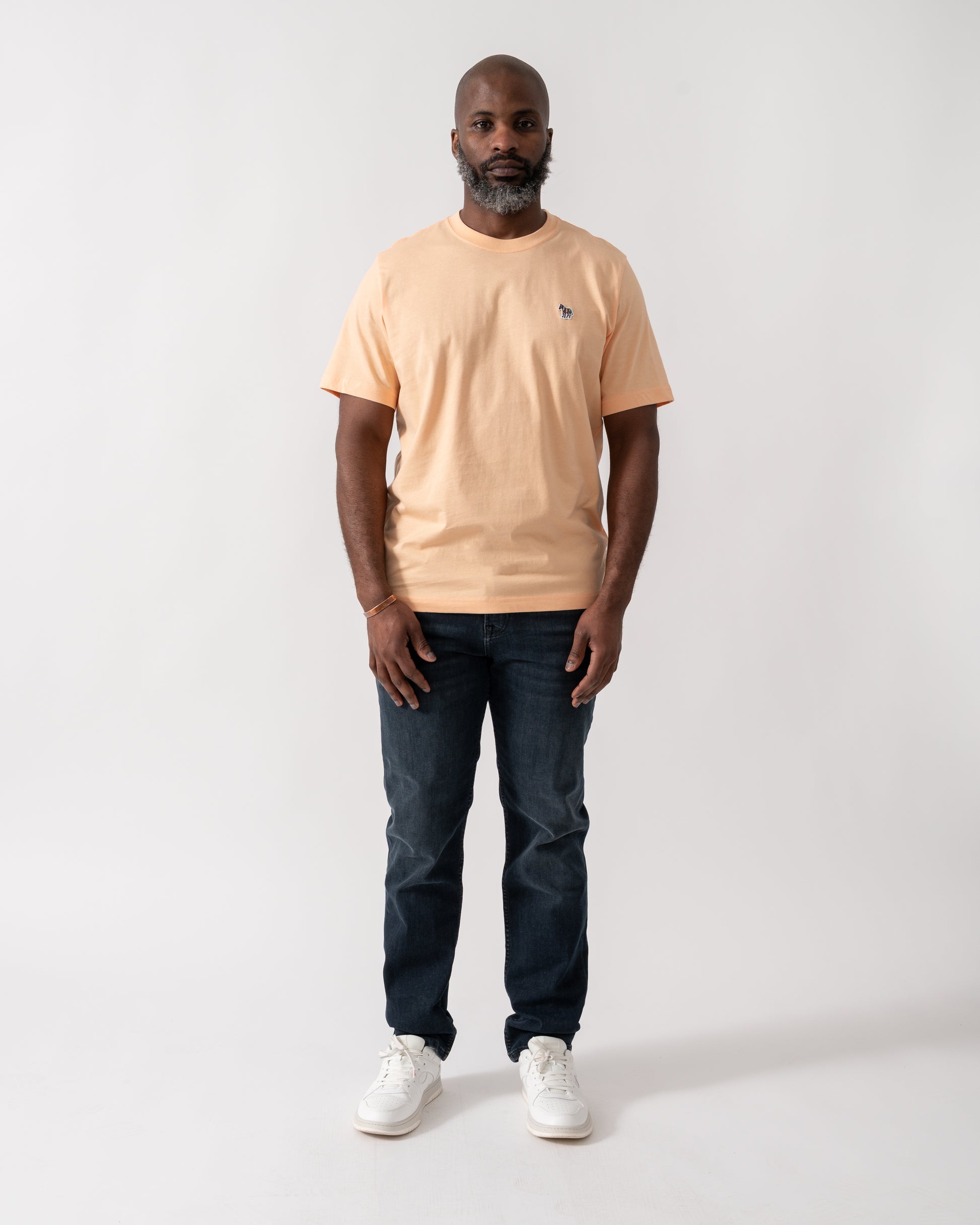 Full length shot of a Model wearing a PS Paul Smith Mens Short Sleeve Zebra Graphic T-Shirt in Orange
