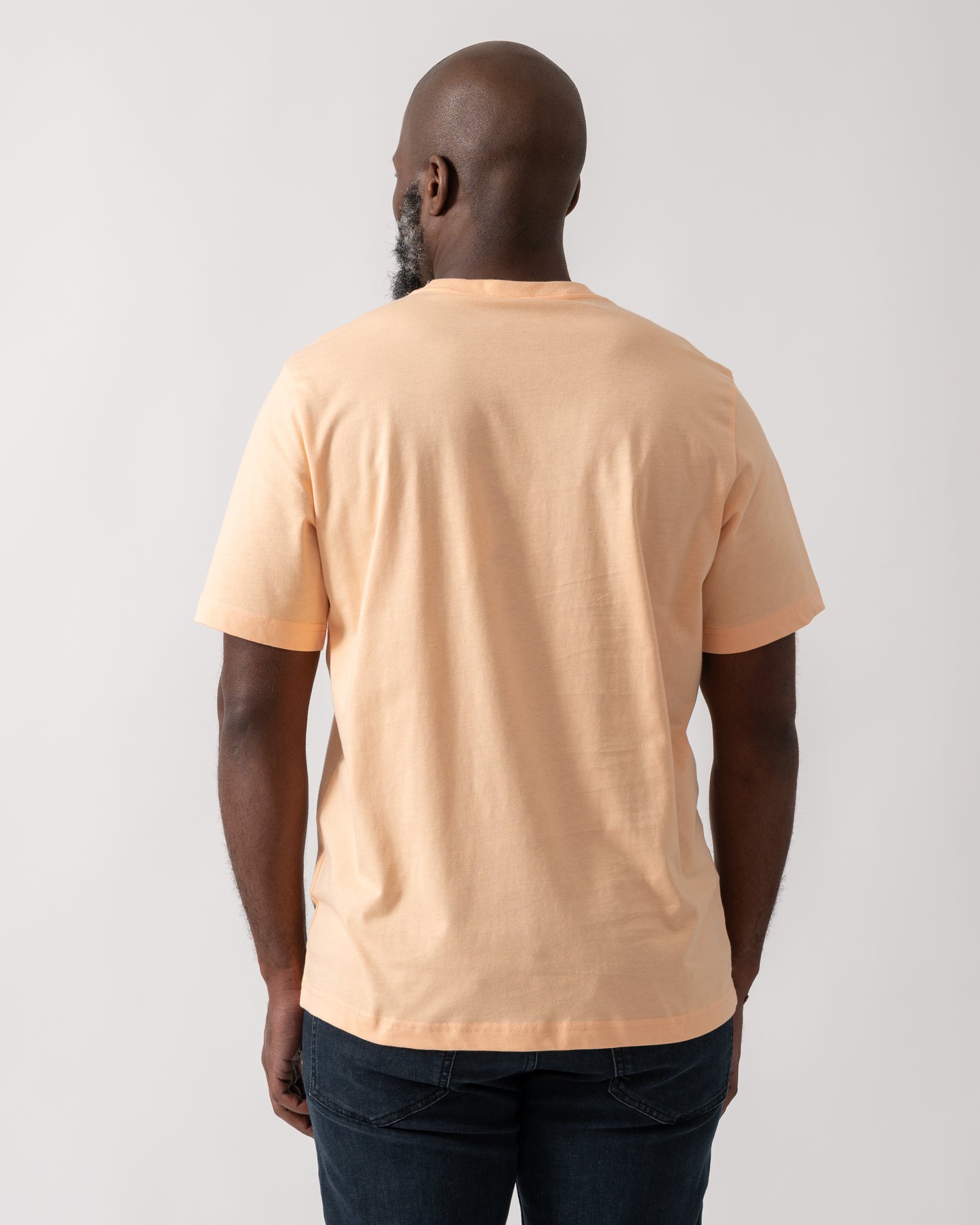 Back shot of a Model wearing a PS Paul Smith Mens Short Sleeve Zebra Graphic T-Shirt in Orange