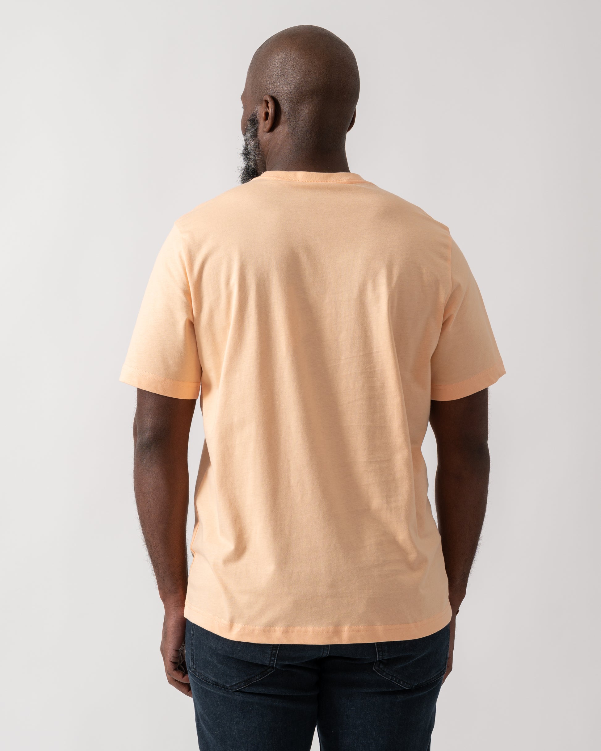 Back shot of a Model wearing a PS Paul Smith Mens Short Sleeve Zebra Graphic T-Shirt in Orange