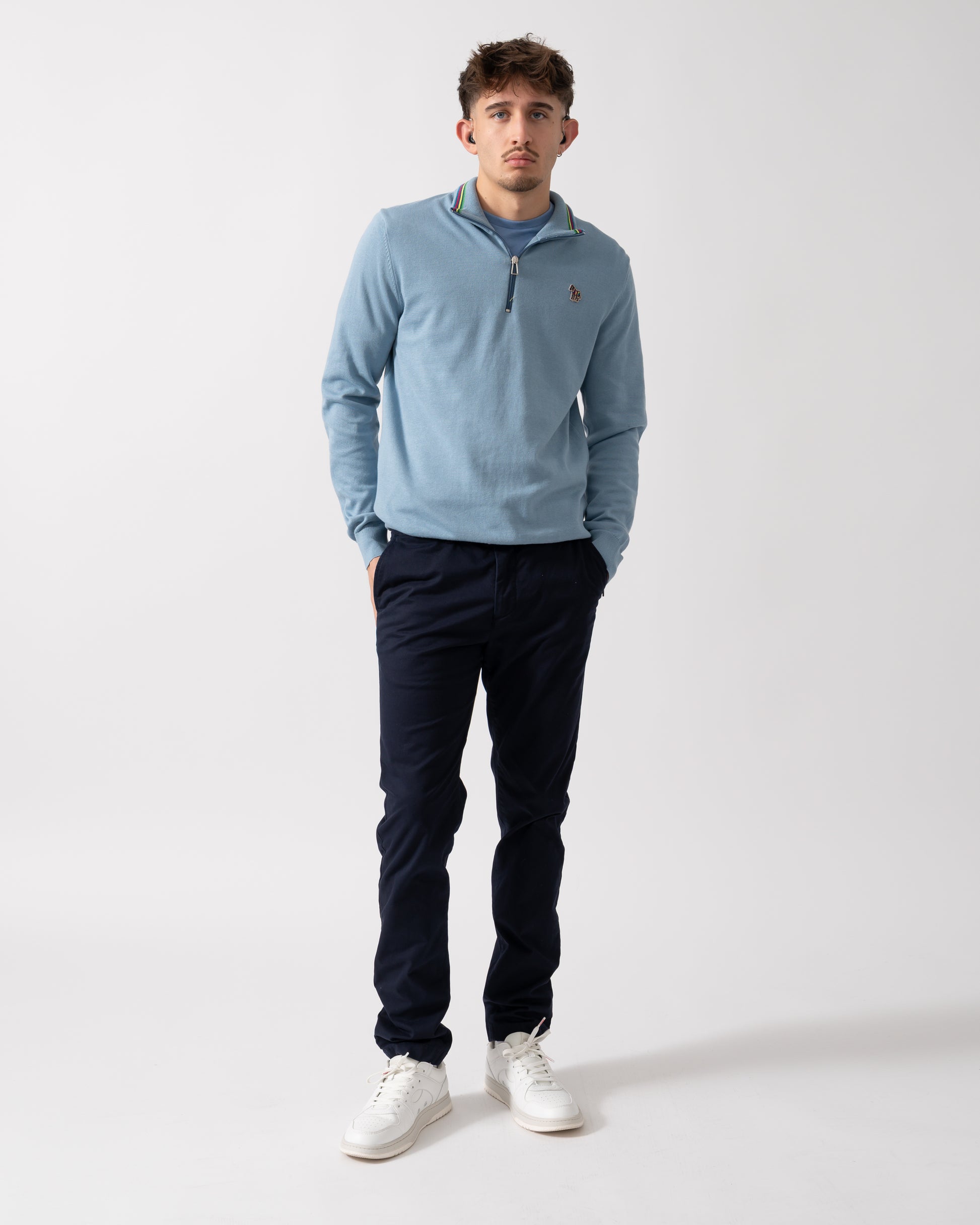 Full length of a Model wearing a PS Paul Smith Mens Sweater Zip Neck Zebera Badge in Blue
