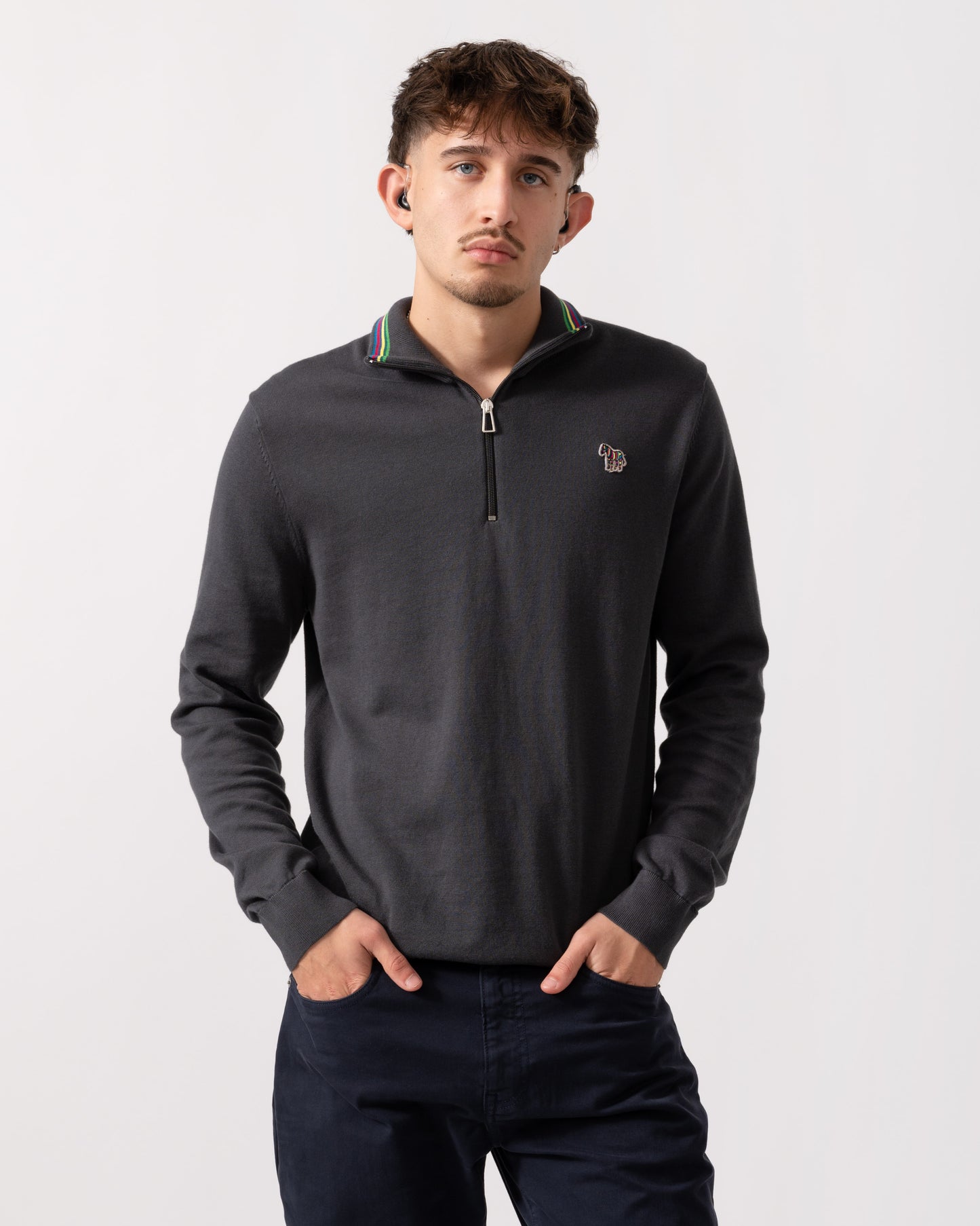 Model wearing a PS Paul Smith Mens Sweater Zip Neck Zebera Badge in Grey