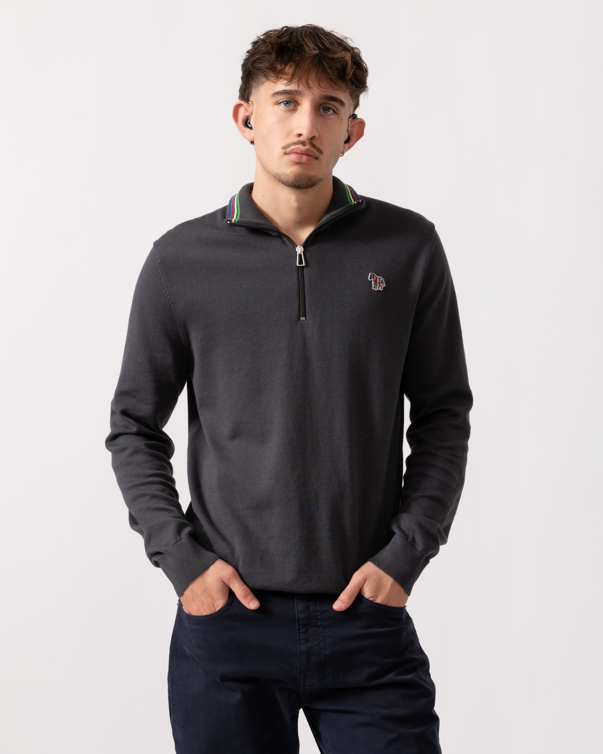 Model wearing a PS Paul Smith Mens Sweater Zip Neck Zebera Badge in Grey