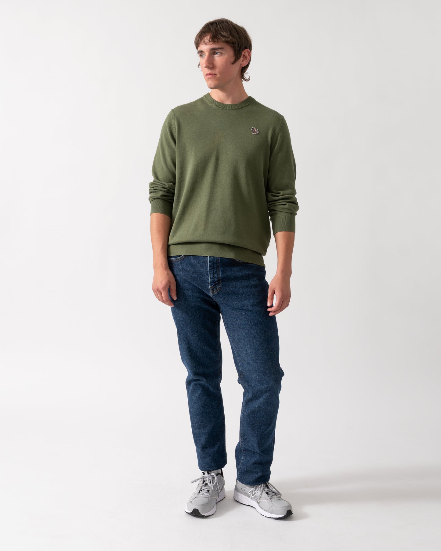 full length shot of a model wearing a PS Paul Smith Mens Zebra Badge Crew Neck Sweater in 35C Green