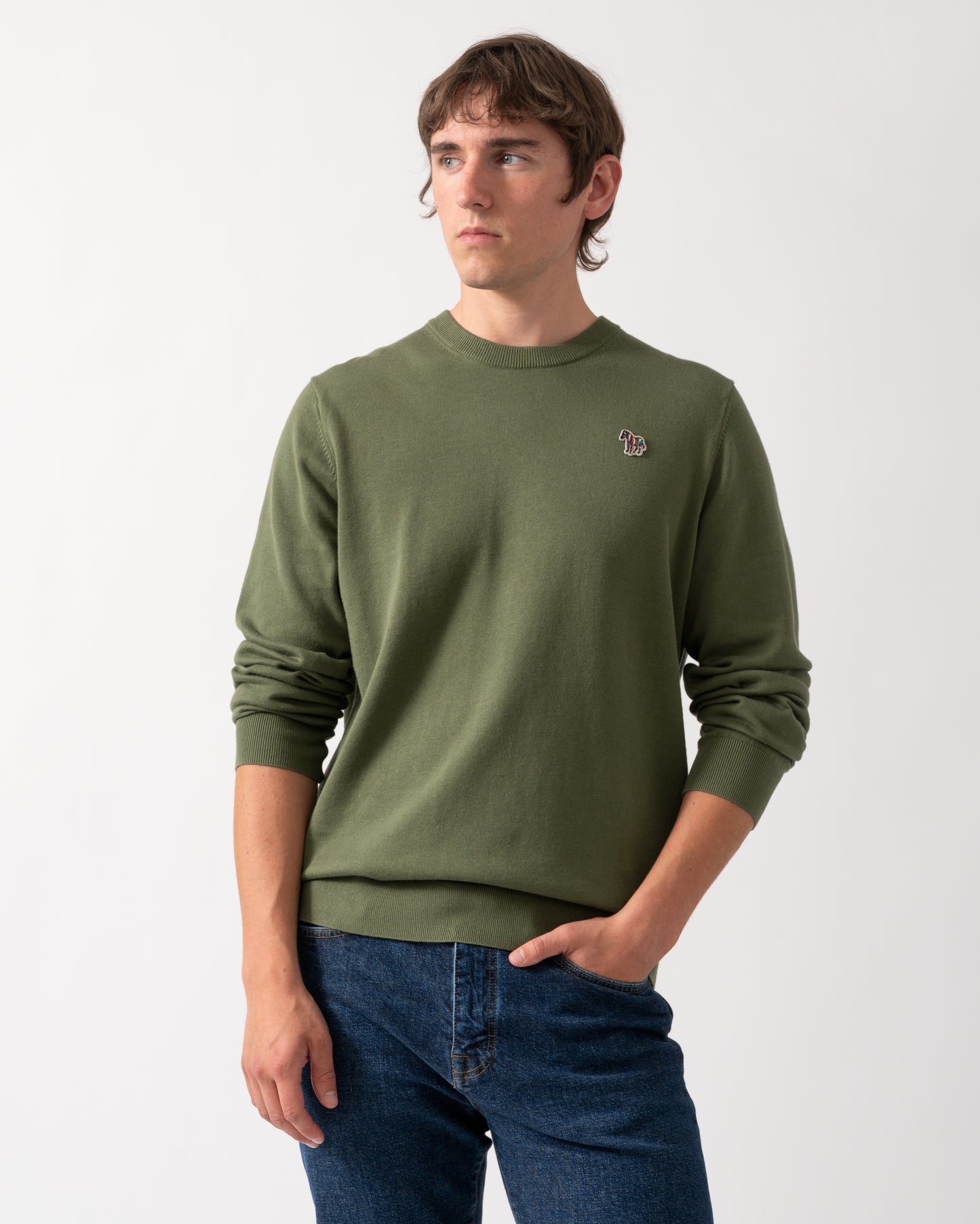 model wearing a PS Paul Smith Mens Zebra Badge Crew Neck Sweater in 35C Green