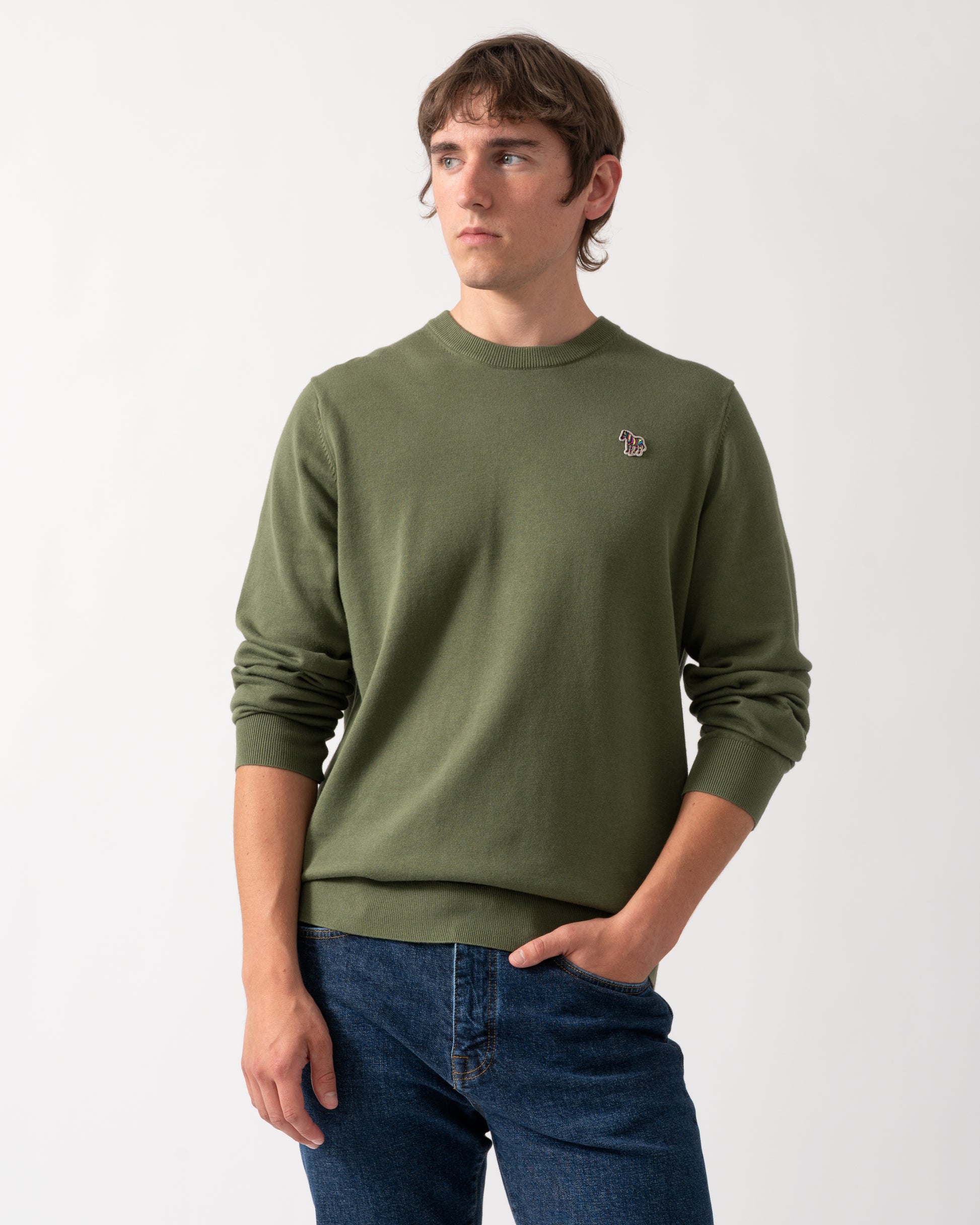model wearing a PS Paul Smith Mens Zebra Badge Crew Neck Sweater in 35C Green