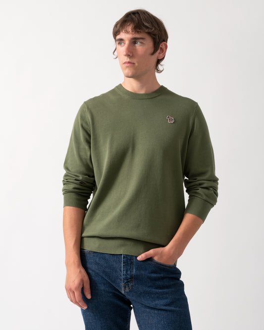 model wearing a PS Paul Smith Mens Zebra Badge Crew Neck Sweater in 35C Green