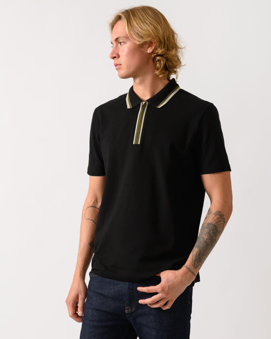 a studio photograph of a model wearing a PS Paul Smith Mens Zip Polo Shirt with Tipped Collar and Placket in 79 Black