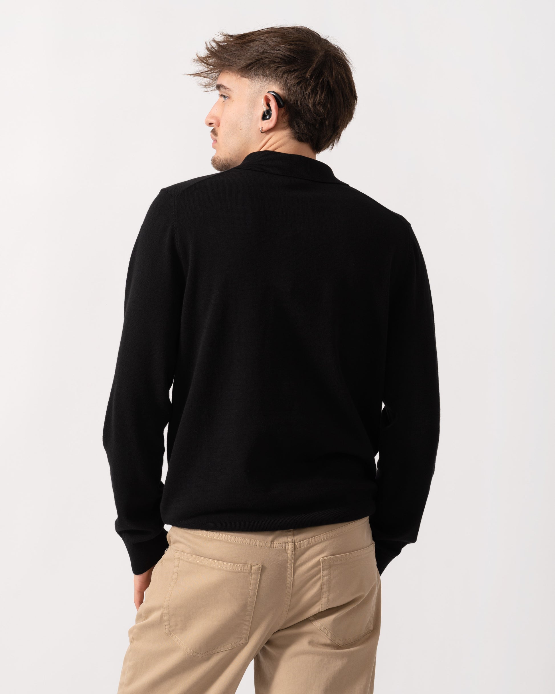 Model wearing a PS Paul Smith Mens Long Sleeve Knit Polo in 79 Black - Back