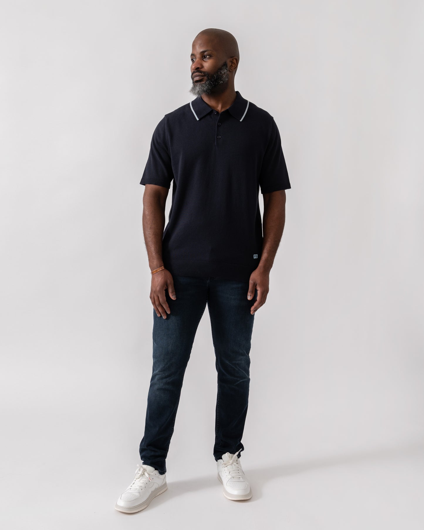 Model wearing PS Paul Smith Mens Short Sleeve Knit Polo in 49 Blue - Full Length