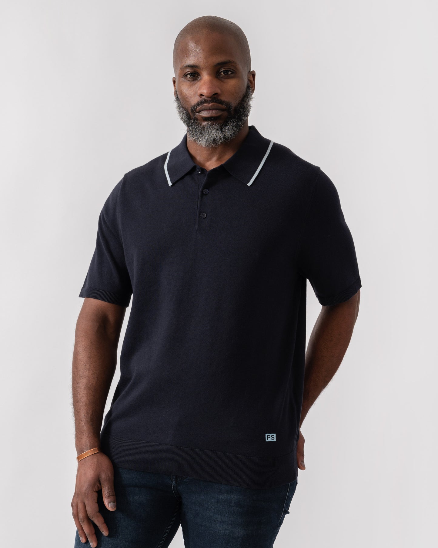 Model wearing PS Paul Smith Mens Short Sleeve Knit Polo in 49 Blue - Main
