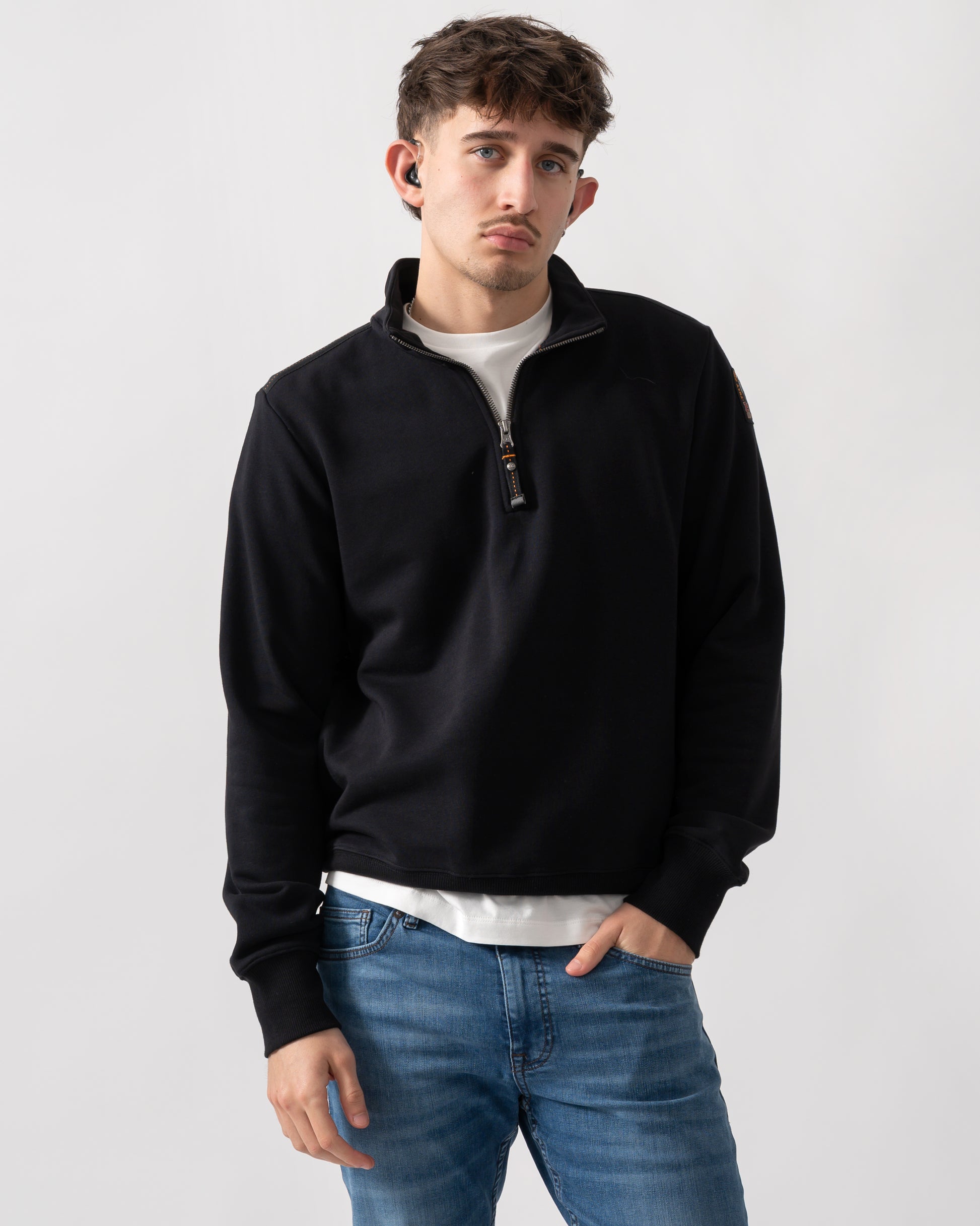 studio shot of a model wearing a Parajumpers Broad Peak Mens quarter Zip Sweatshirt in Black 541