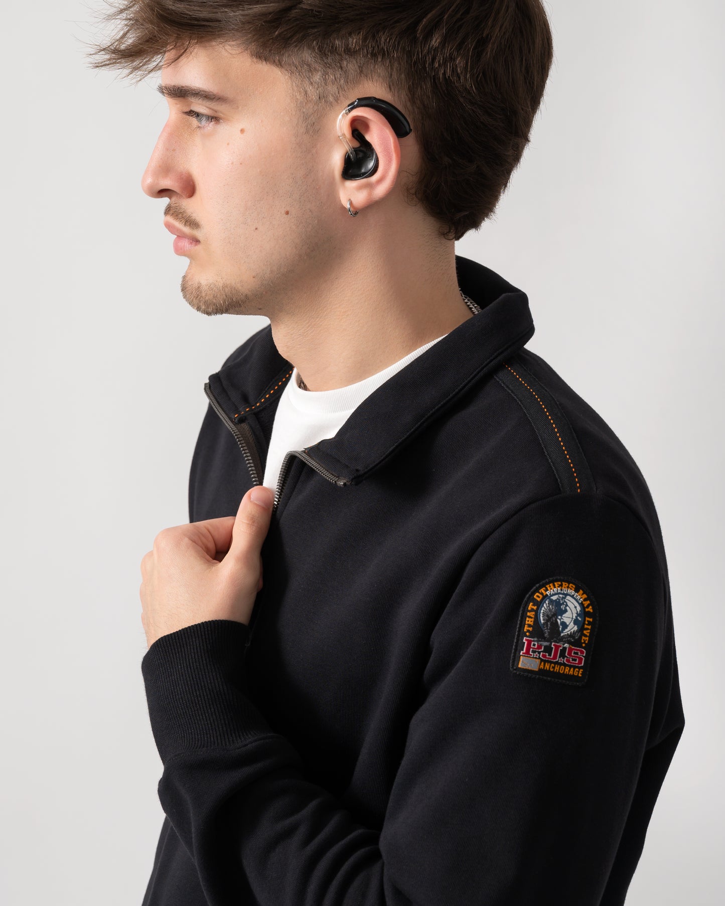 side shot of a model wearing a Parajumpers Broad Peak Mens quarter Zip Sweatshirt in Black 541