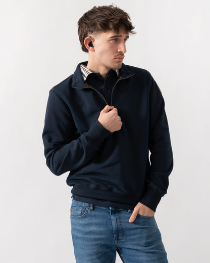 studio shot of a model wearing a Parajumpers Broad Peak Mens quarter Zip Sweatshirt in Blue Navy 316