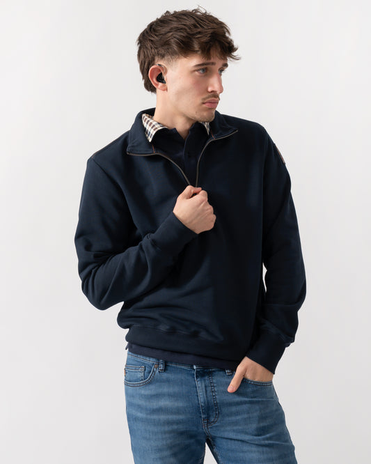 studio shot of a model wearing a Parajumpers Broad Peak Mens quarter Zip Sweatshirt in Blue Navy 316