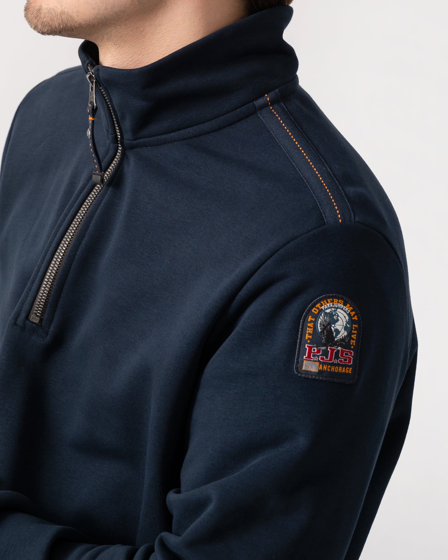 close up shot of a model wearing a Parajumpers Broad Peak Mens quarter Zip Sweatshirt in Blue Navy 316