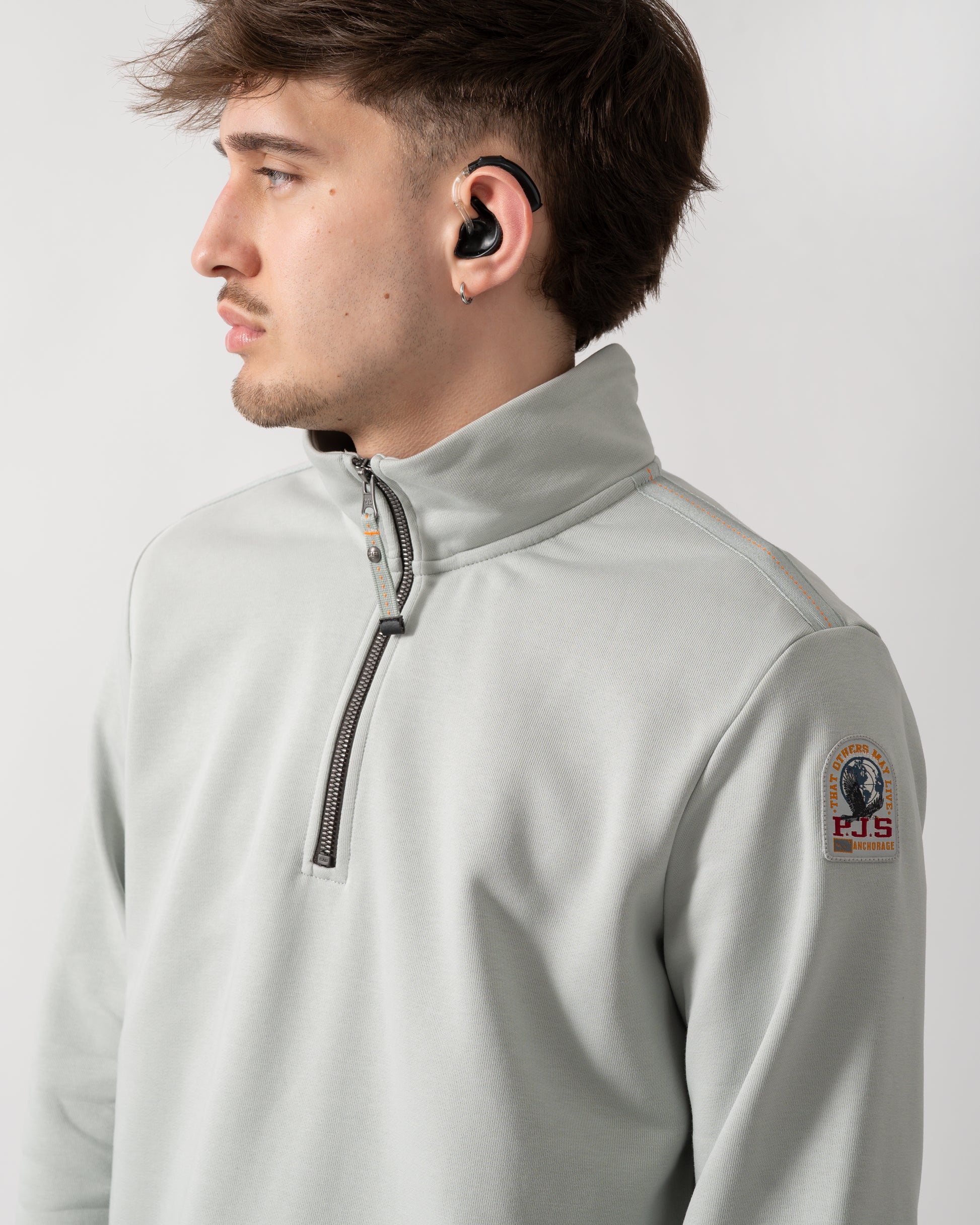 close up shot of a model wearing a Parajumpers Broad Peak Mens 1/4 Zip Sweatshirt in Fresh Grey 271