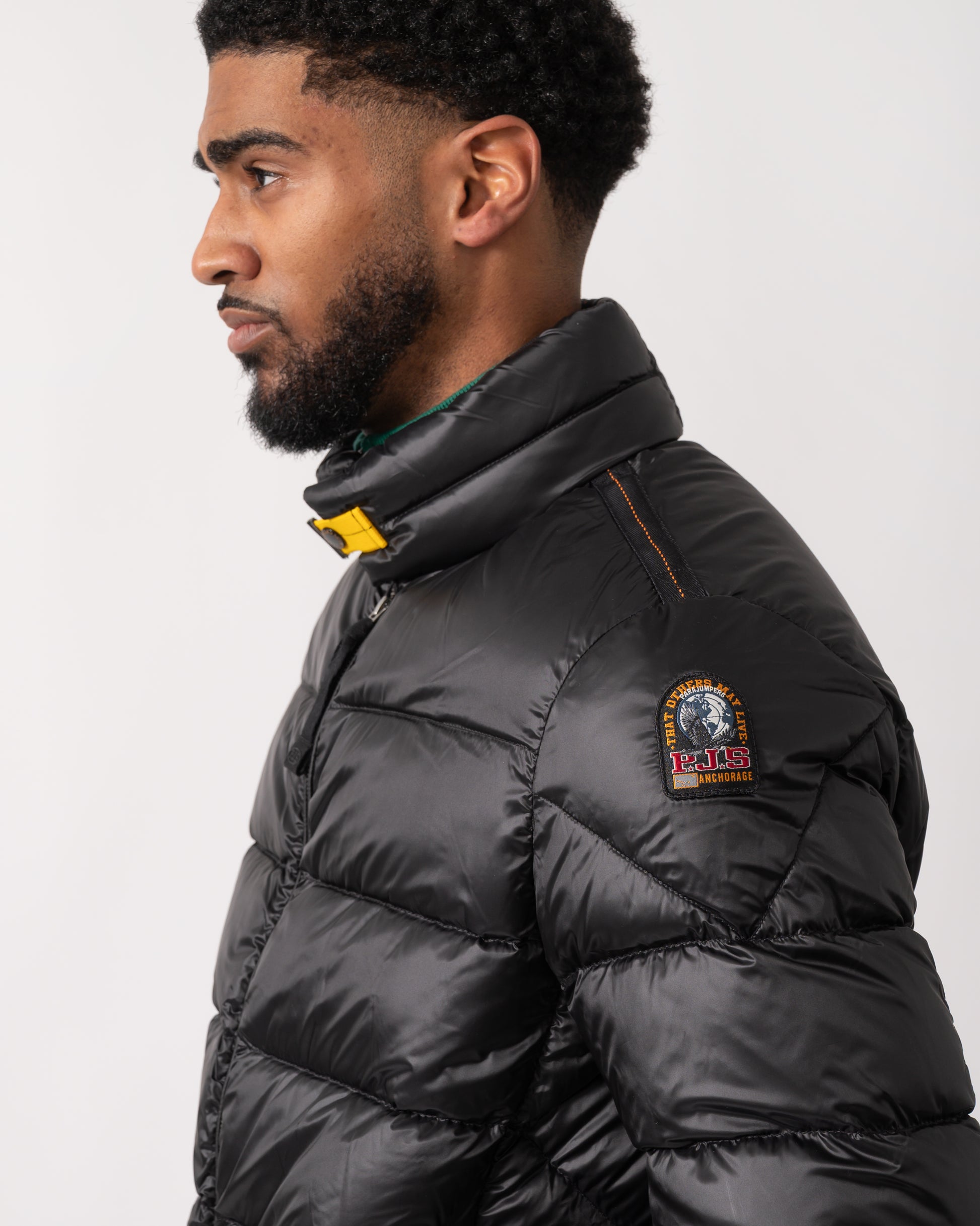 close up of a model wearing a Parajumpers Dillon Mens Down Jacket in Black