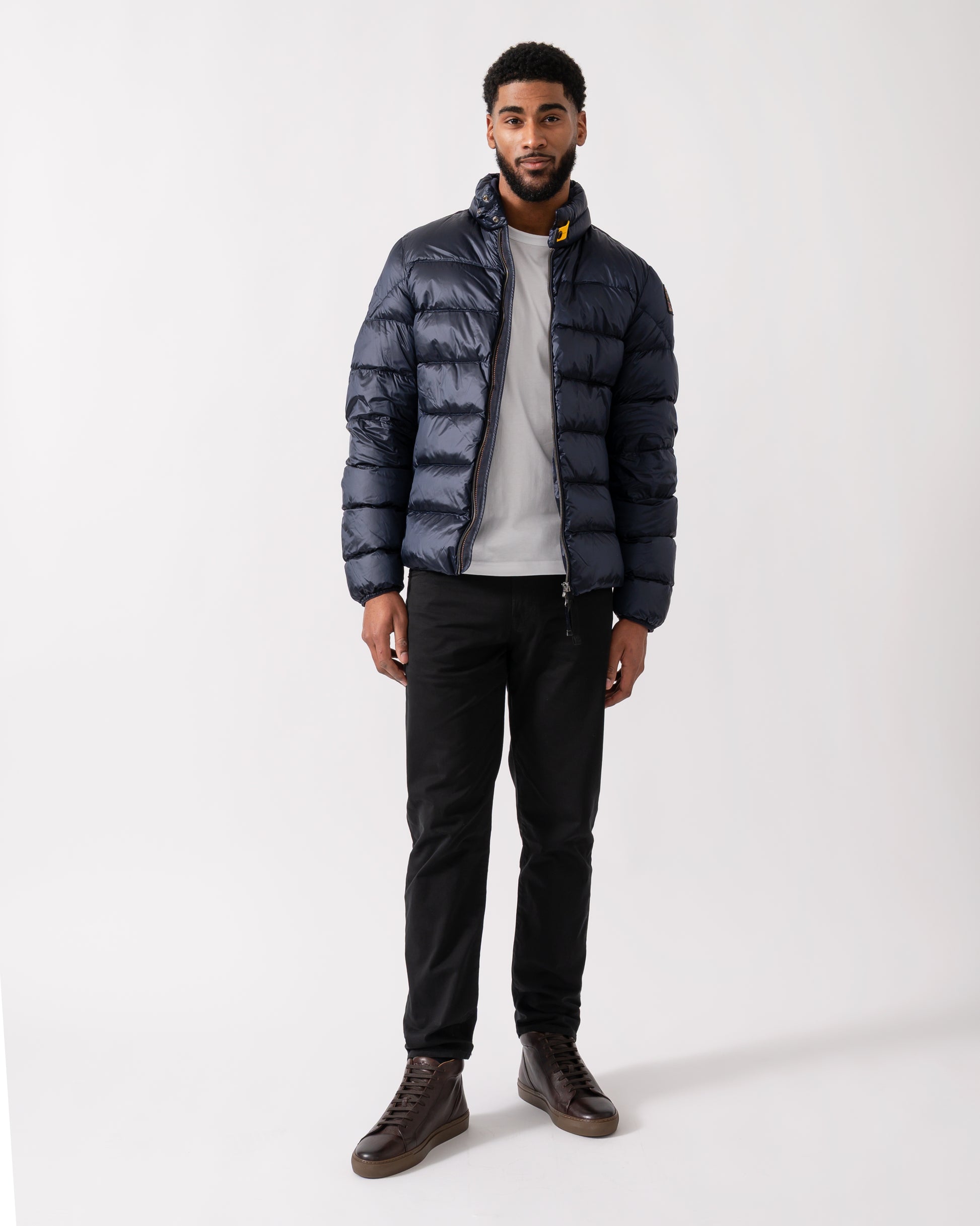 Wide shot of a model wearing a Parajumpers Dillon Mens Down Jacket in Blue Navy