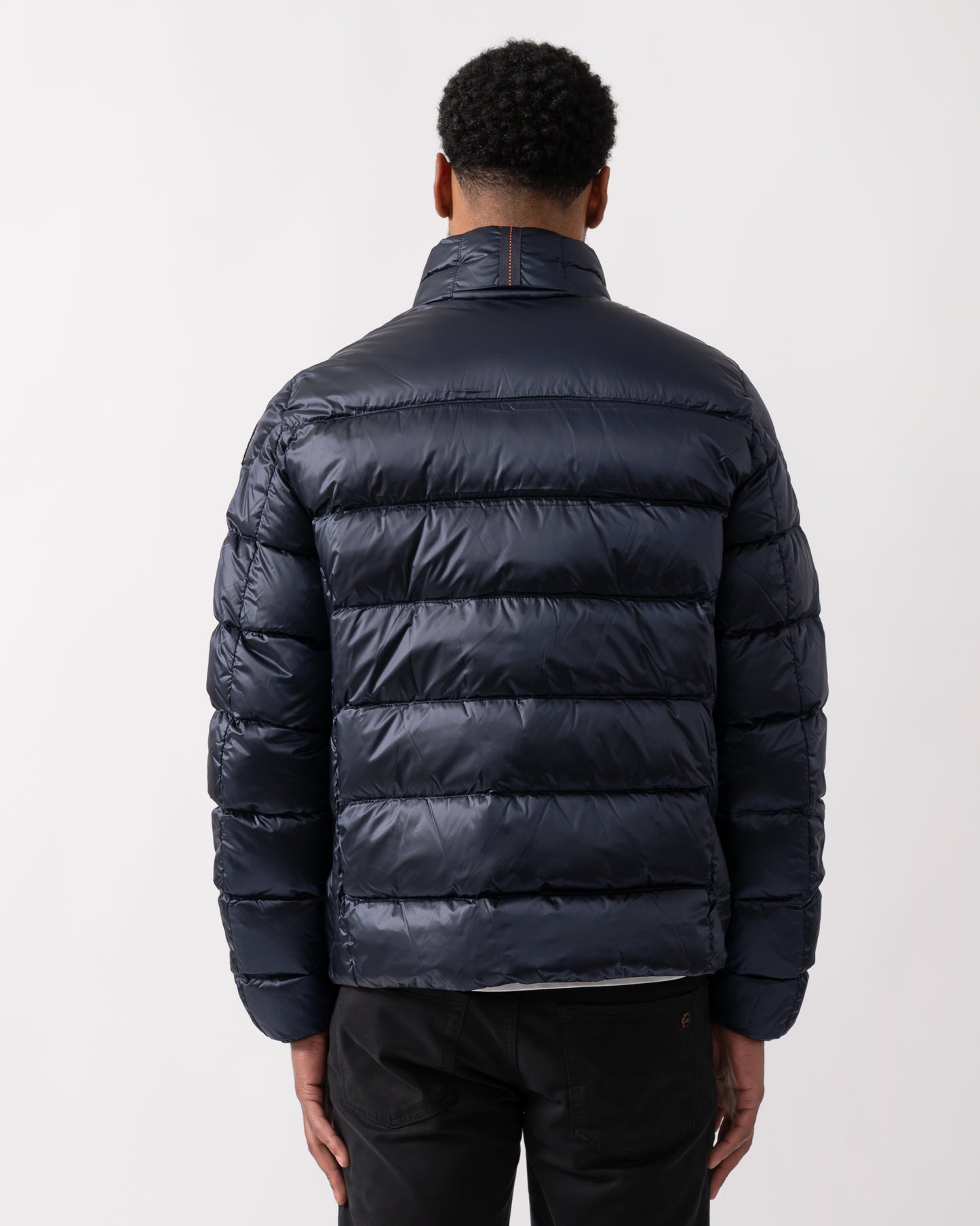 back shot of a model wearing a Parajumpers Dillon Mens Down Jacket in Blue Navy