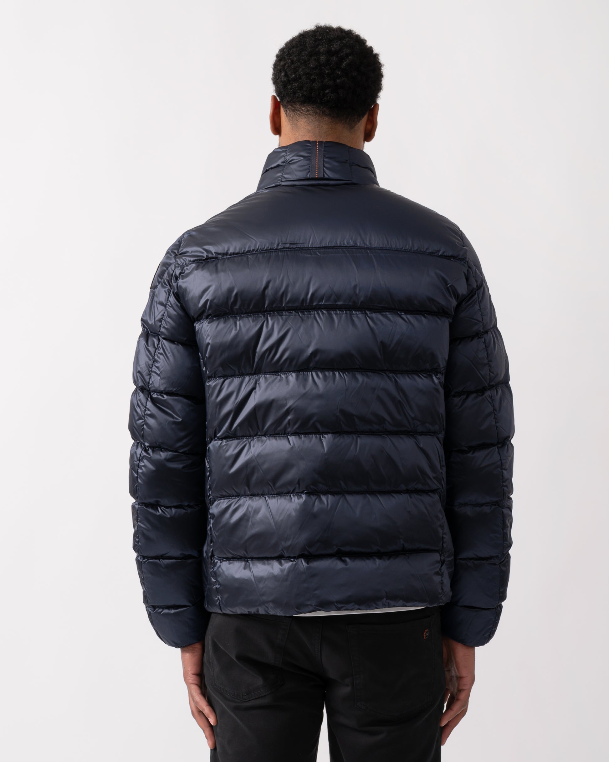 back shot of a model wearing a Parajumpers Dillon Mens Down Jacket in Blue Navy