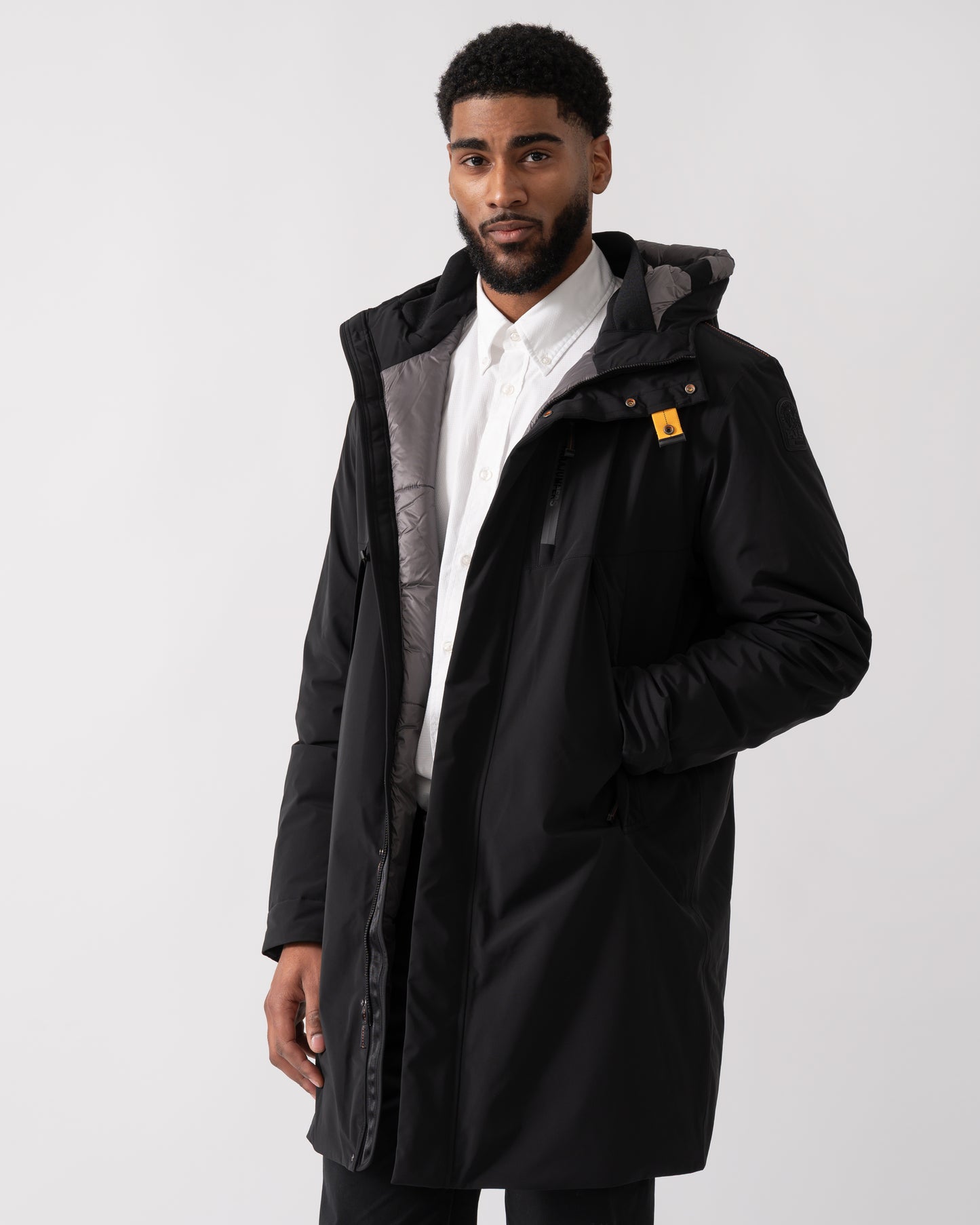 model wearing a Parajumpers Easy Mens Hooded Padded Coat in Black