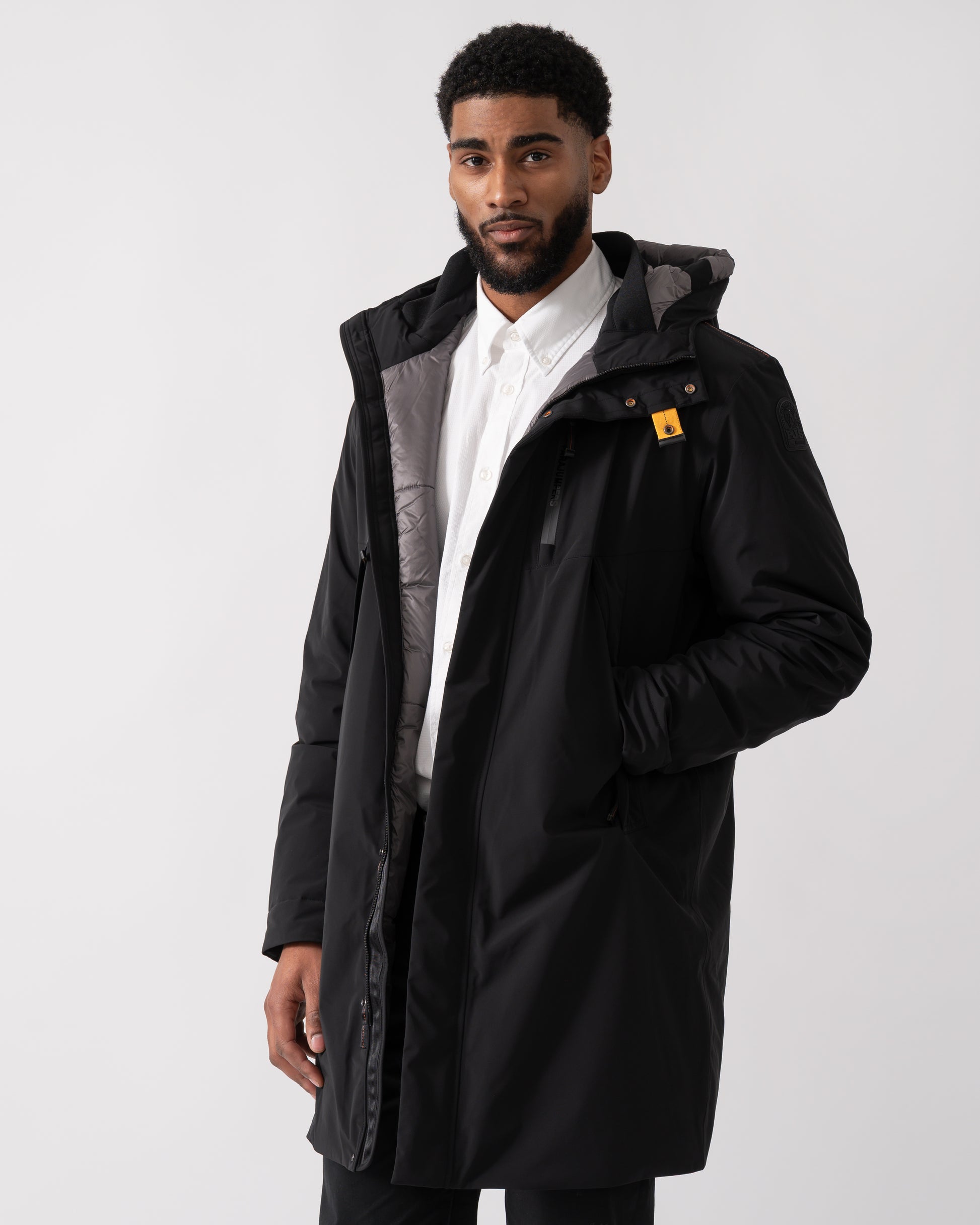 model wearing a Parajumpers Easy Mens Hooded Padded Coat in Black